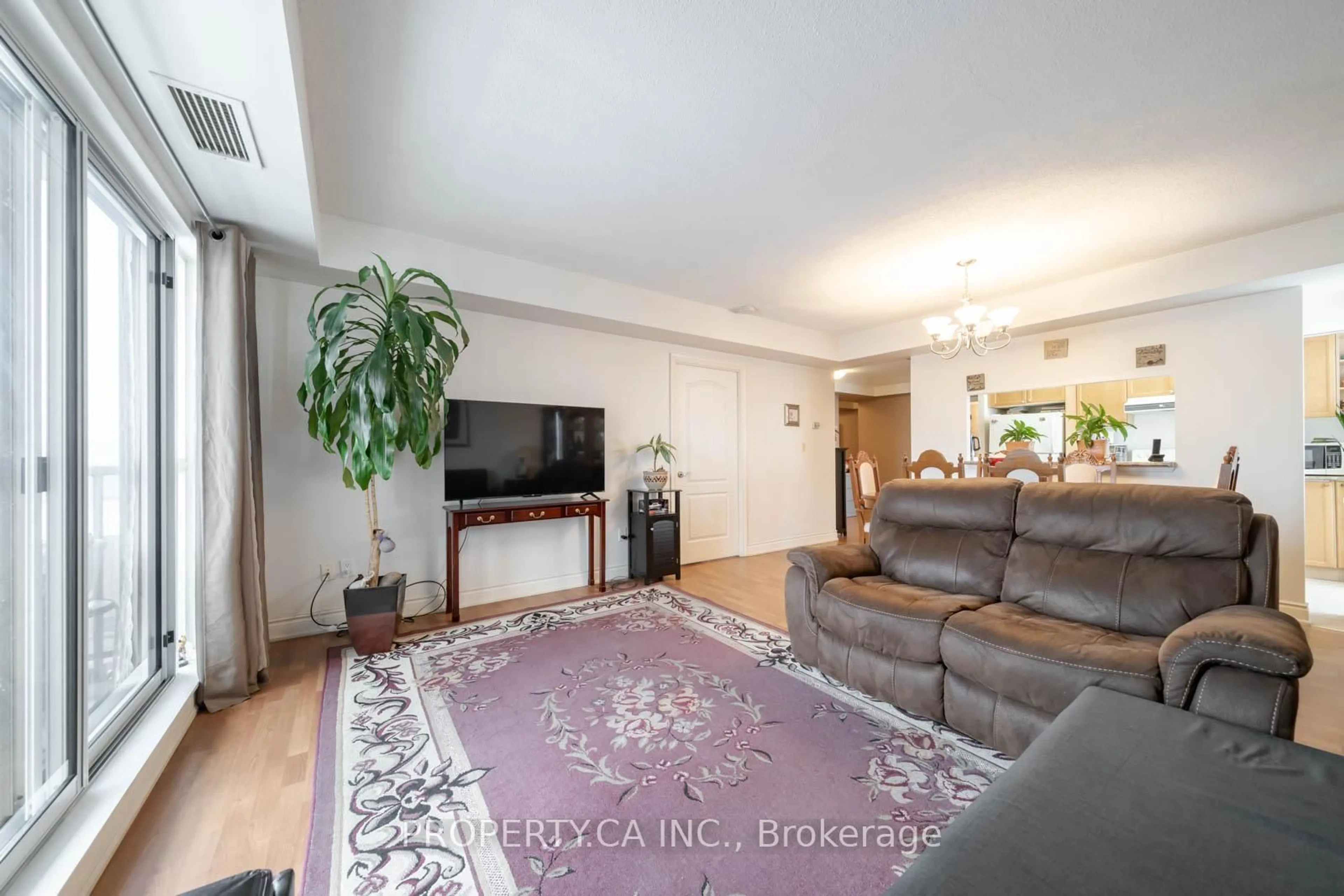Living room with furniture, unknown for 2088 Lawrence Ave #609, Toronto Ontario M9N 3Z9