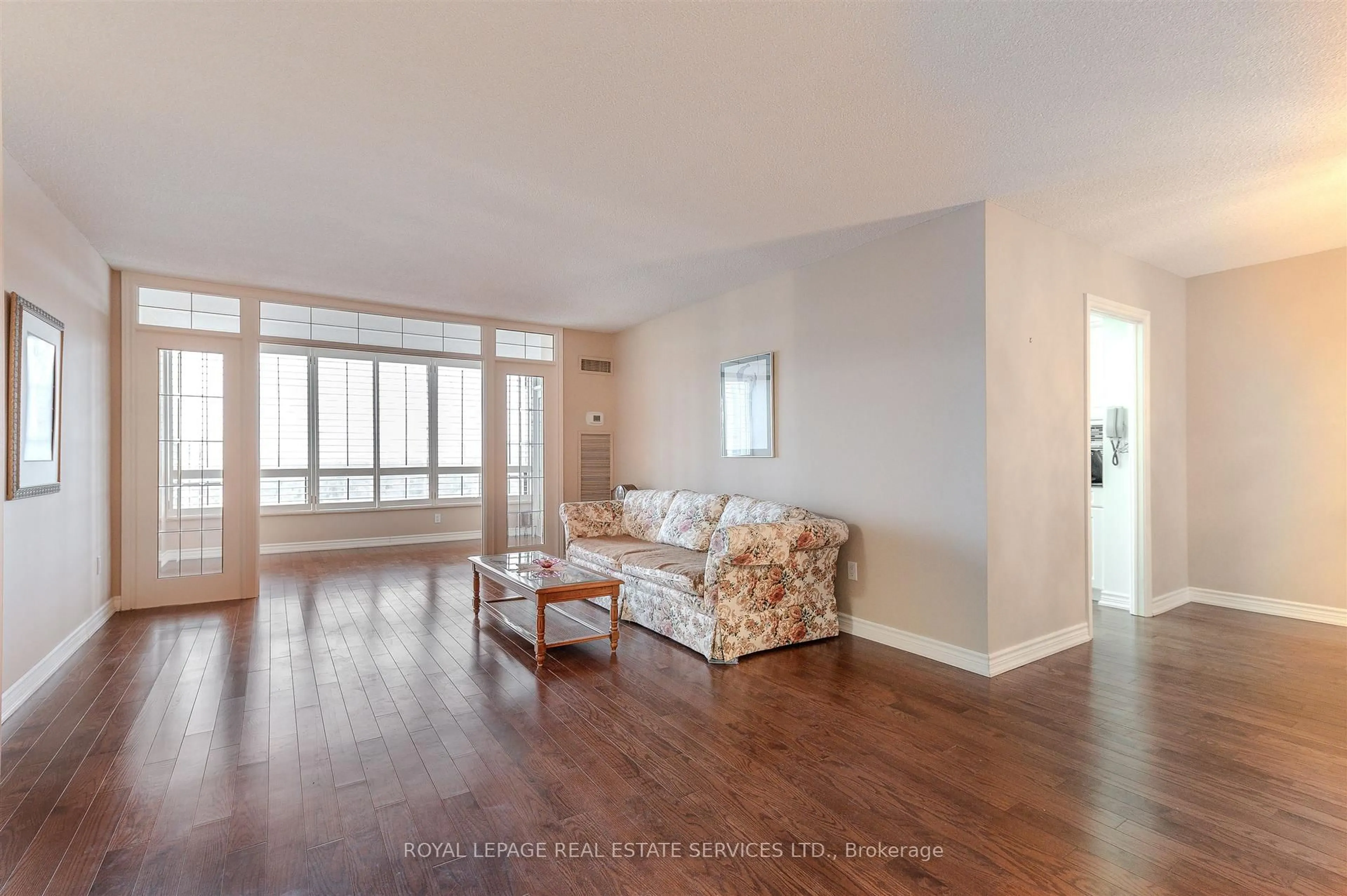 Living room with furniture, wood/laminate floor for 1300 Islington Ave #2504, Toronto Ontario M9A 5C4