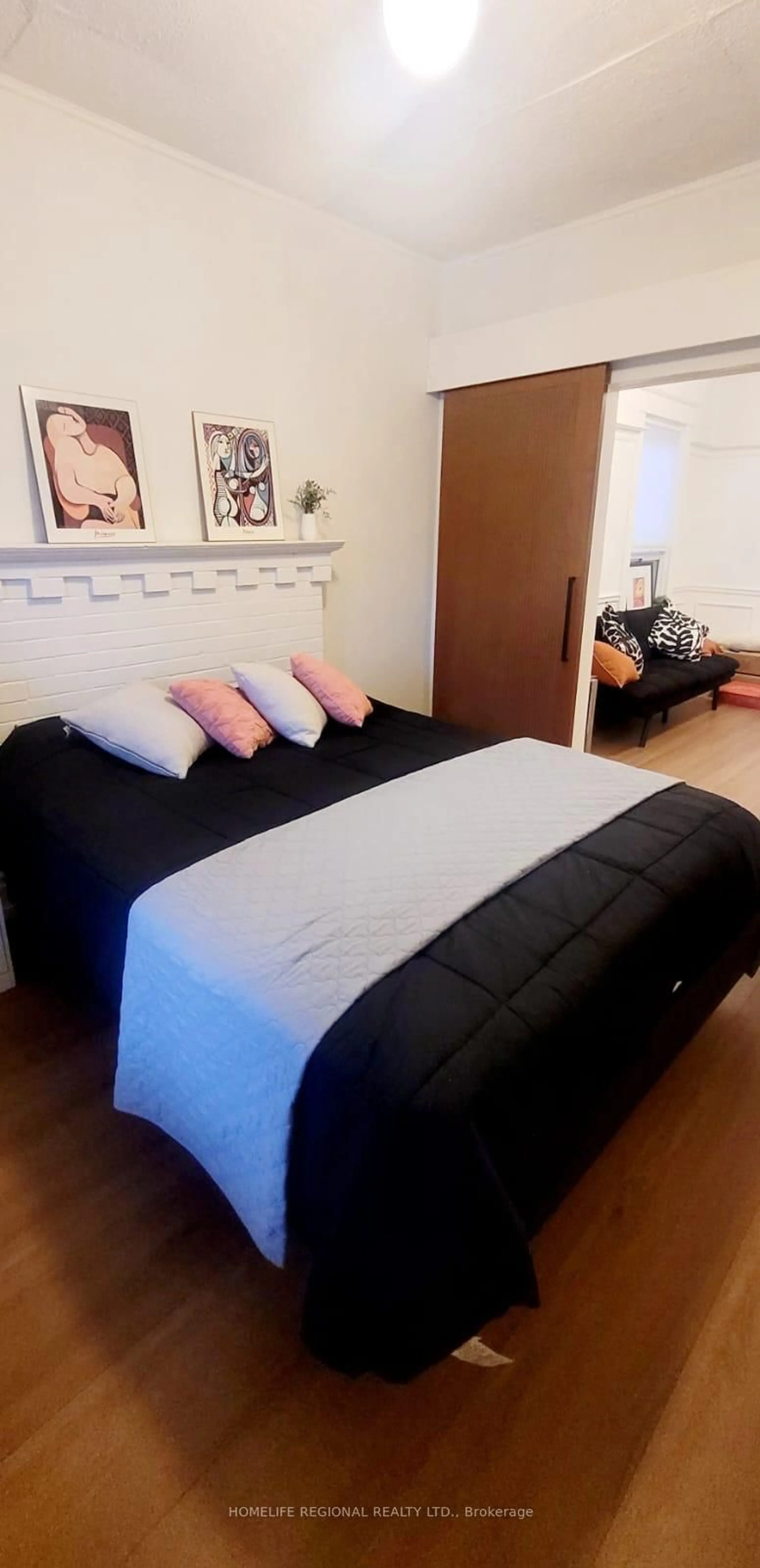 Bedroom with bed, wood/laminate floor for 2378 St Clair Ave, Toronto Ontario M6N 1K8