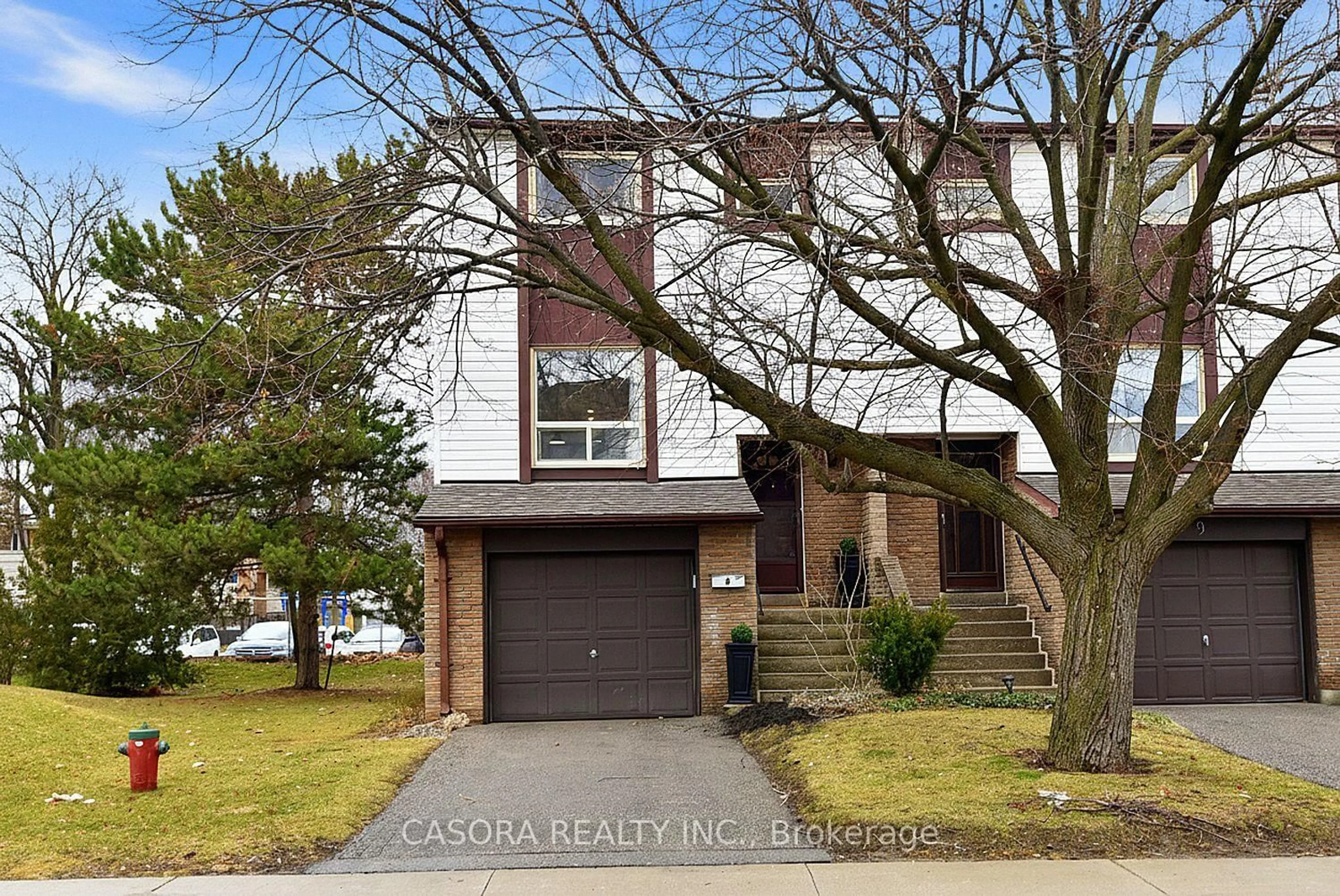 Home with brick exterior material, street for 1221 Dundix Rd #8, Mississauga Ontario L4Y 3Y9