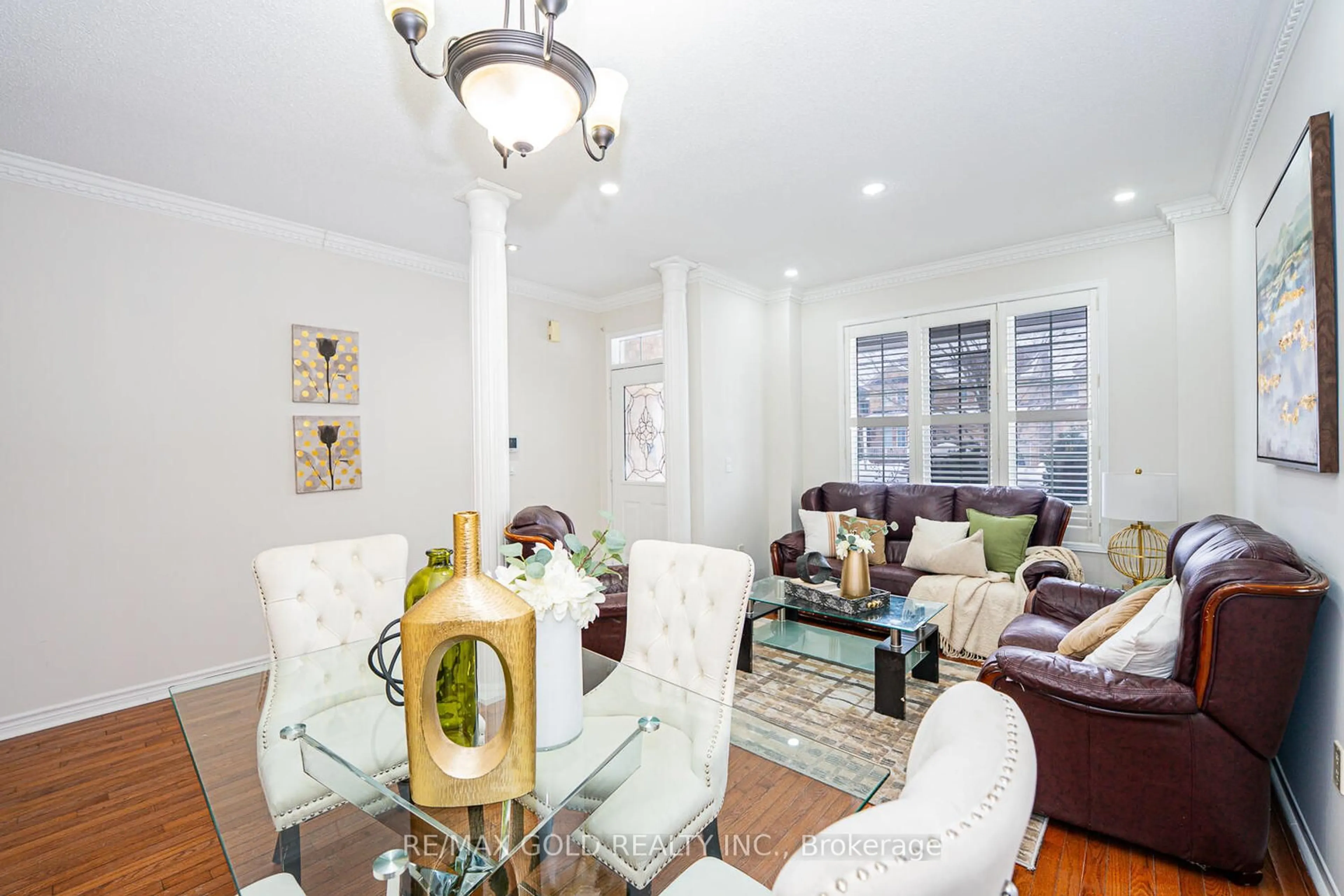 Living room with furniture, wood/laminate floor for 321 Queen Mary Dr, Brampton Ontario L7A 3S6