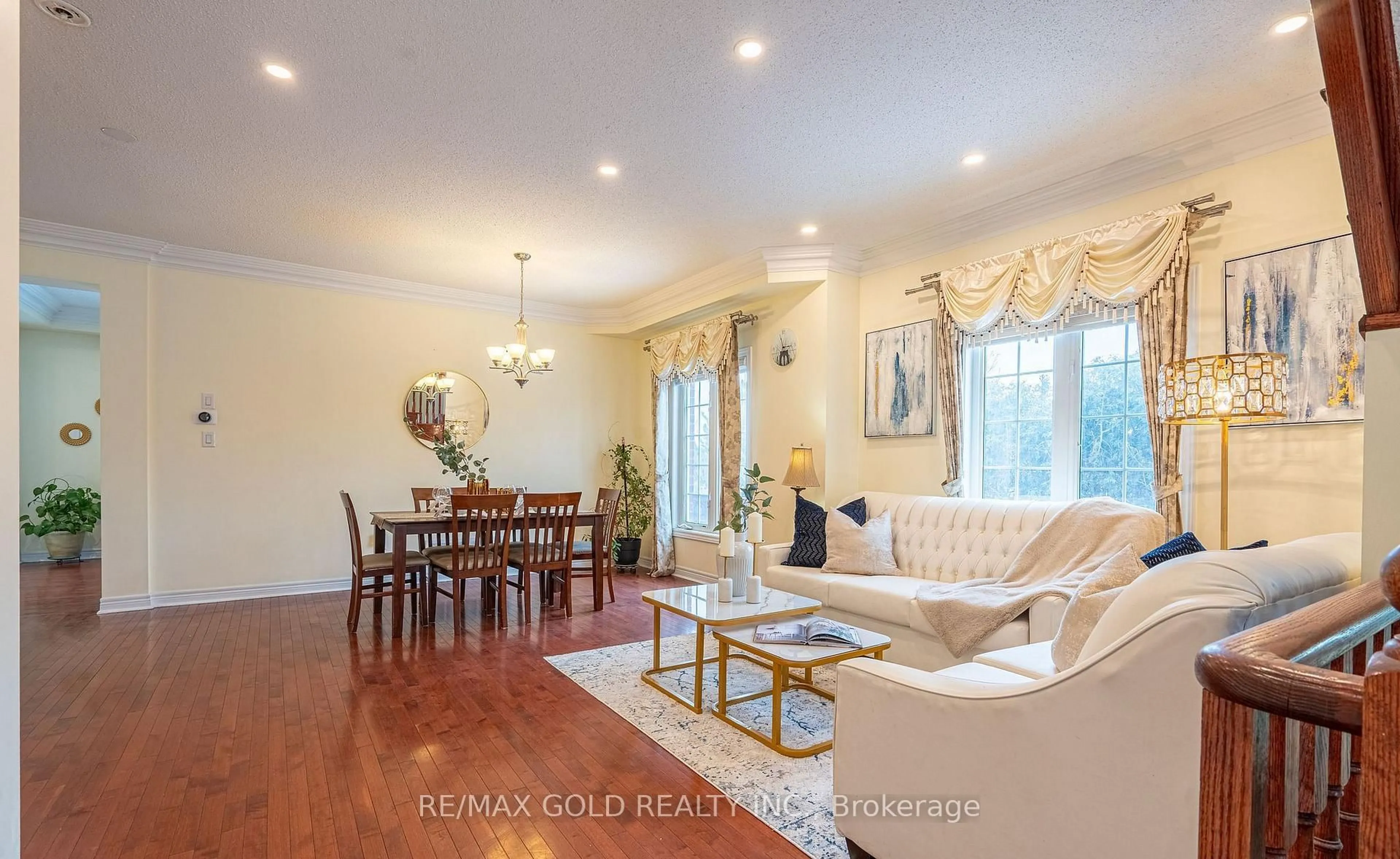 Living room with furniture, wood/laminate floor for 311 Father Tobin Rd, Brampton Ontario L6R 0P4