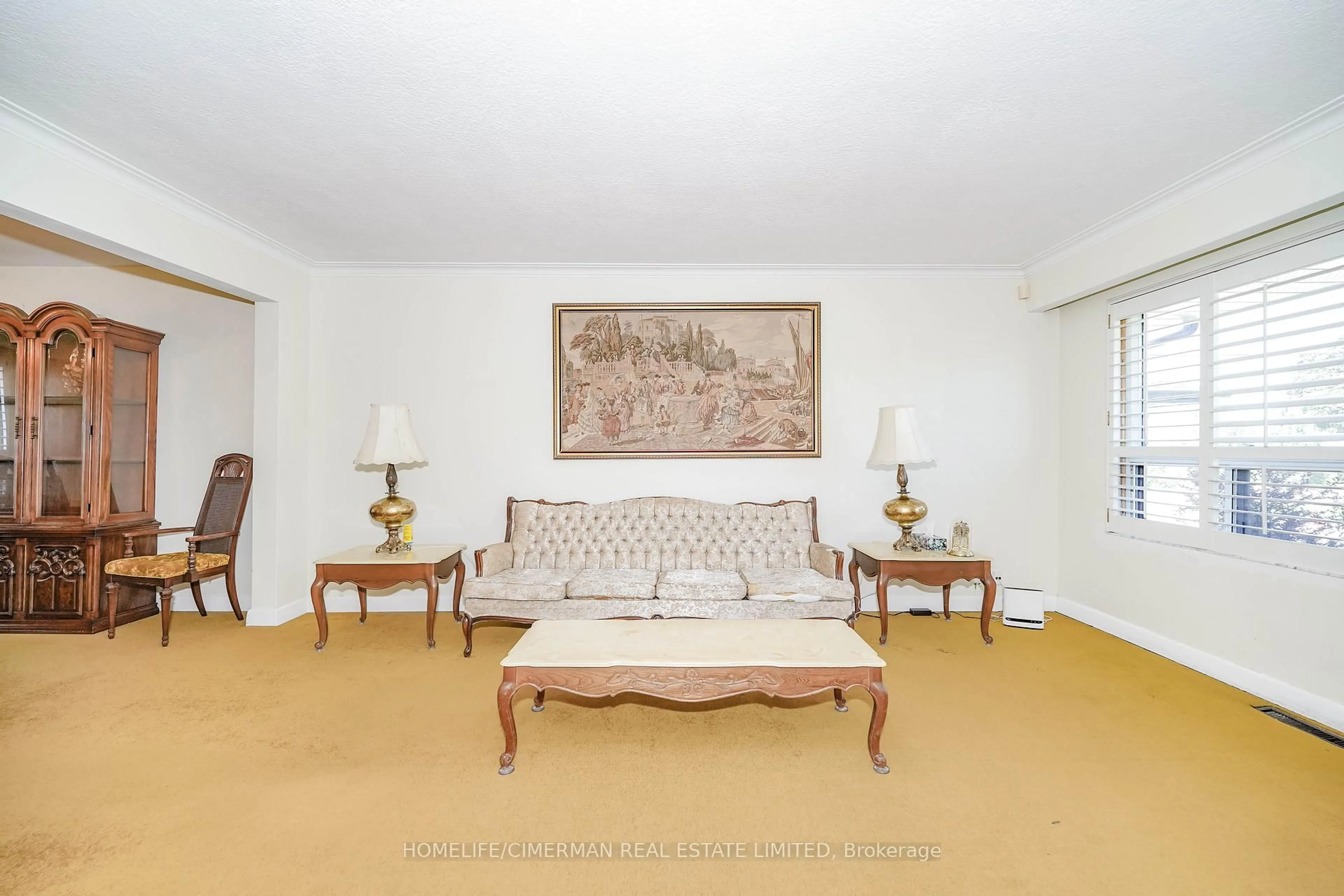 Living room with furniture, carpet floor for 28 Renshaw St, Toronto Ontario M3M 2C8