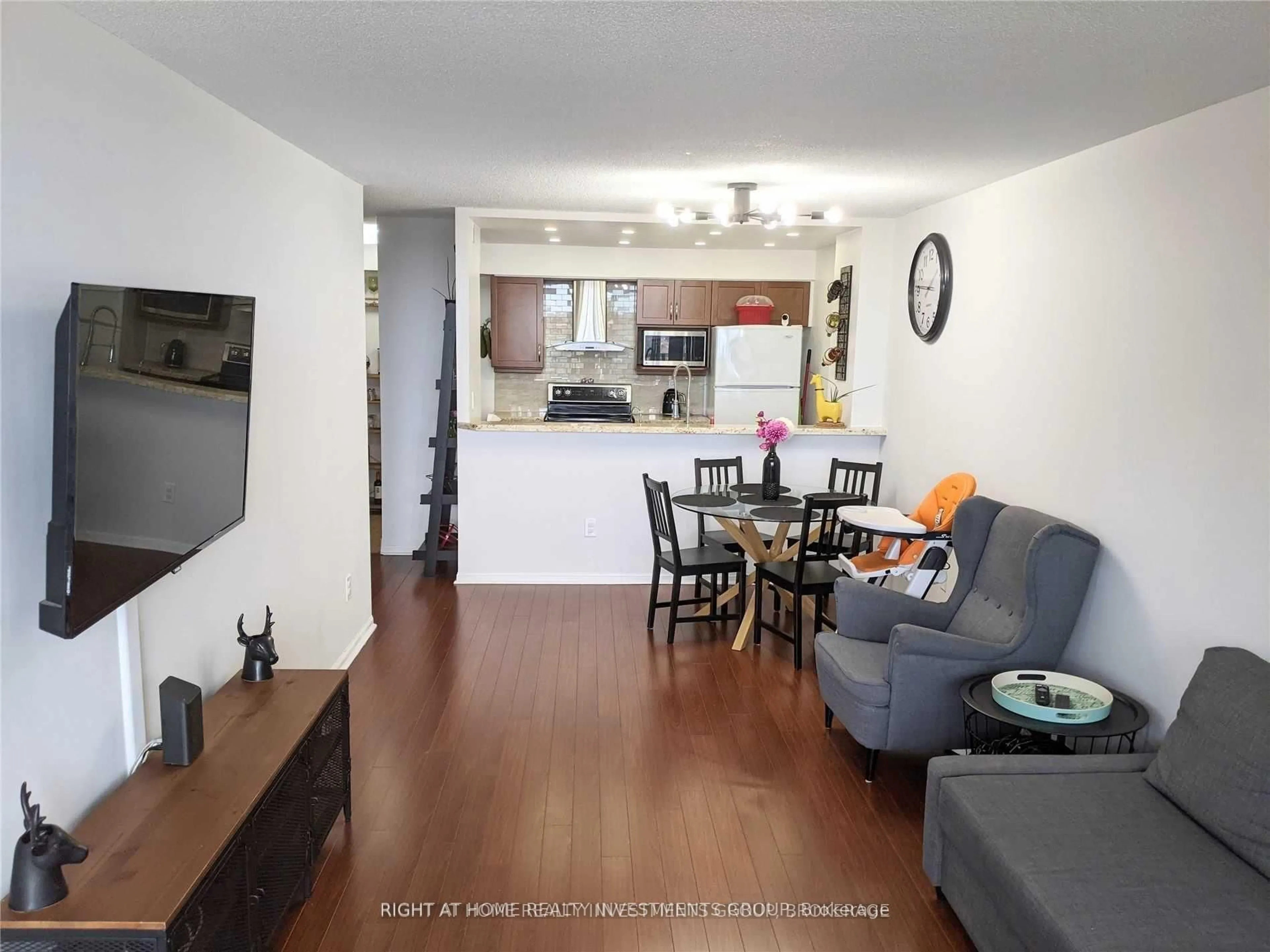 Living room with furniture, wood/laminate floor for 550 Webb Dr #812, Mississauga Ontario L5B 3Y4