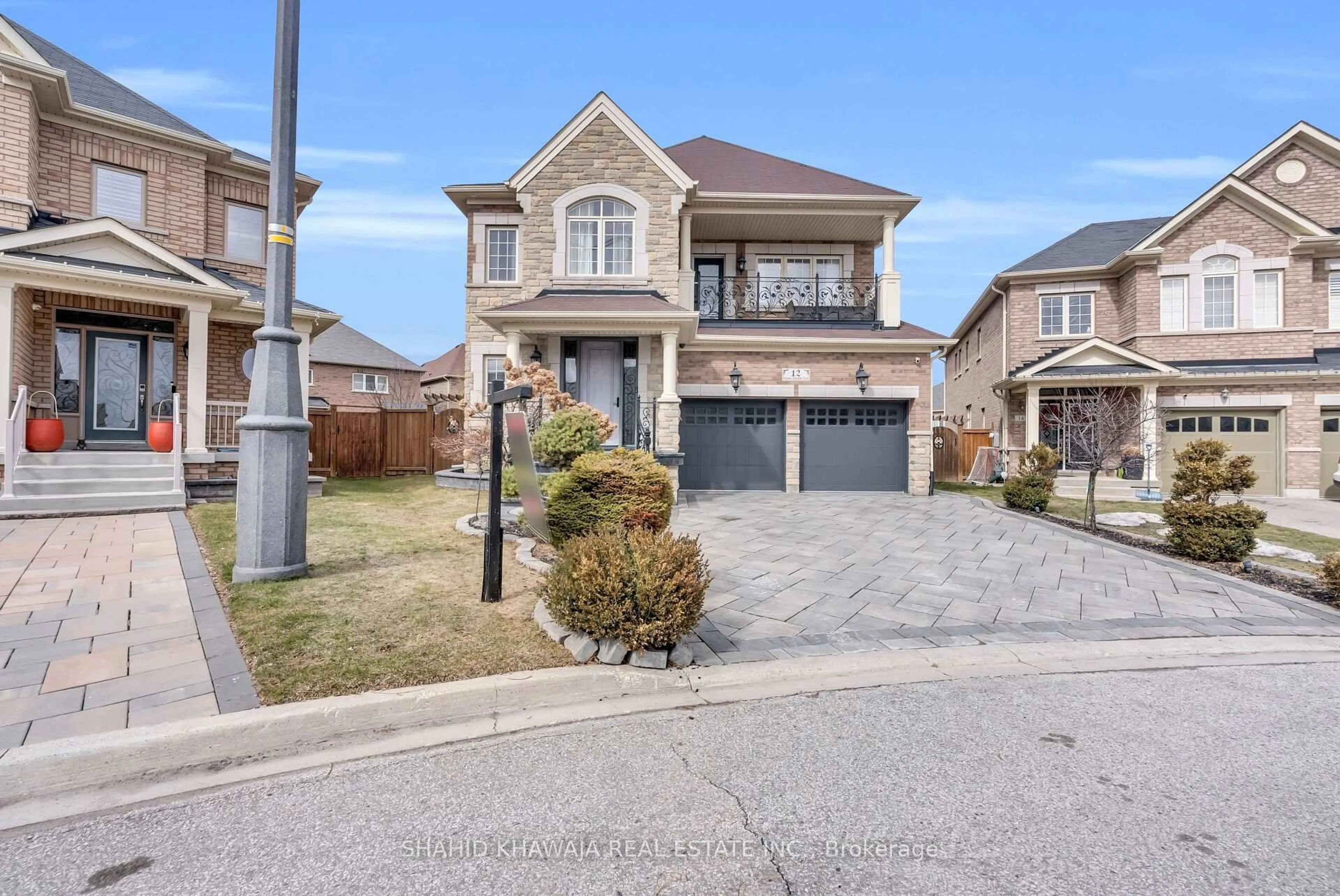 Home with brick exterior material, street for 12 Orangeblossom Tr, Brampton Ontario L6X 3B4