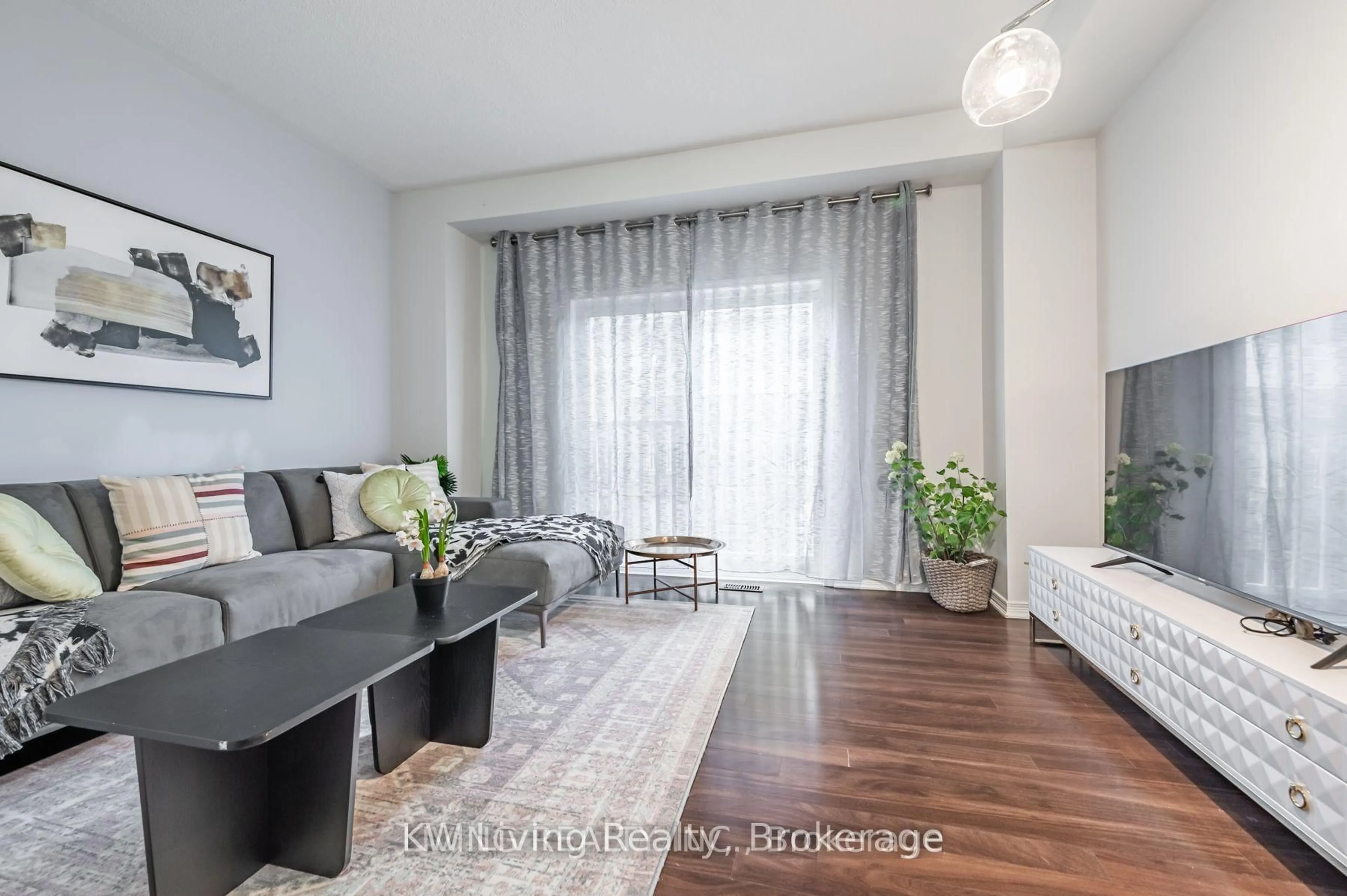 Living room with furniture, wood/laminate floor for 6625 Falconer Dr #25, Mississauga Ontario L5N 0C7