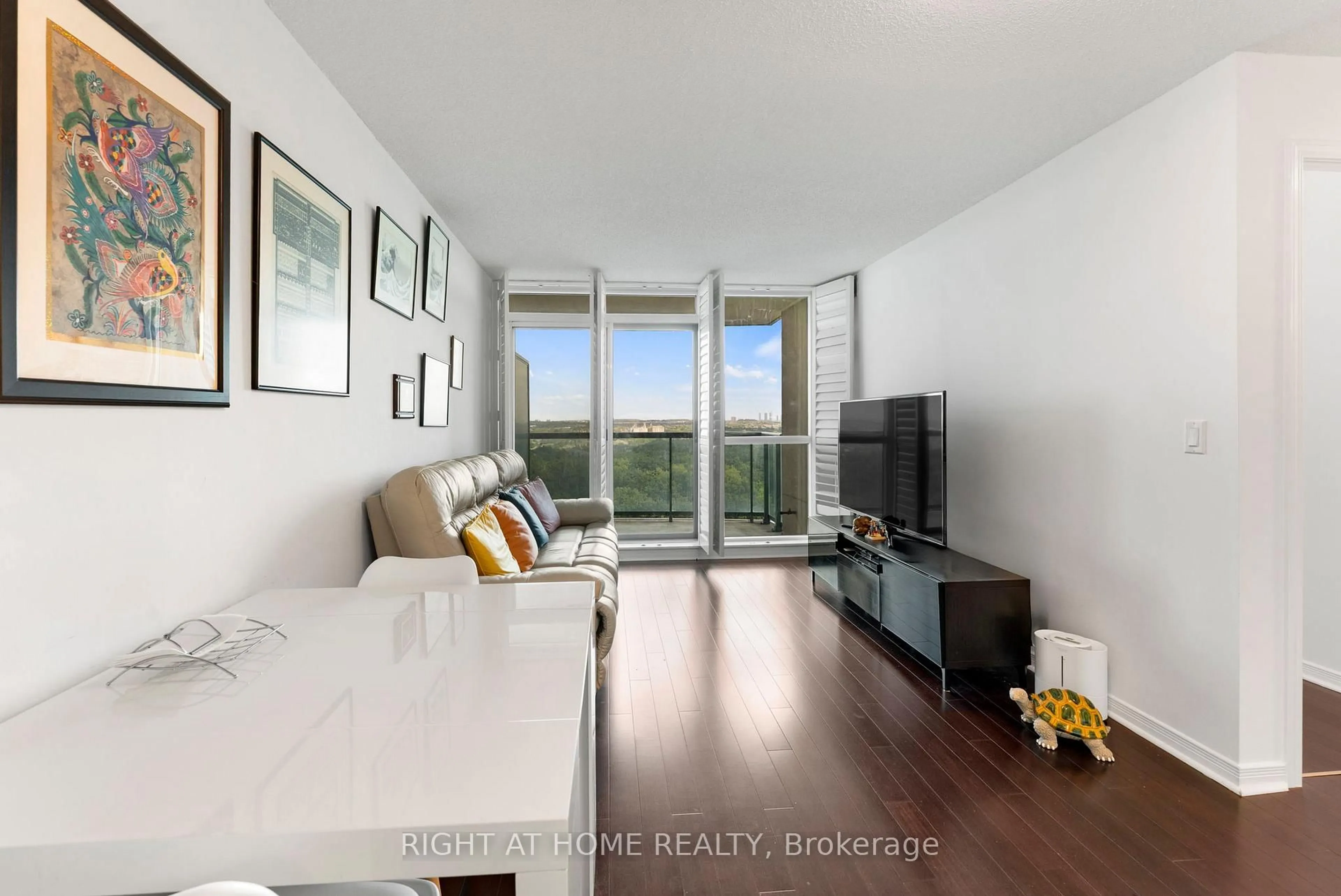 Living room with furniture, wood/laminate floor for 2545 Erin Centre Blvd #1611, Mississauga Ontario L5M 6Z9