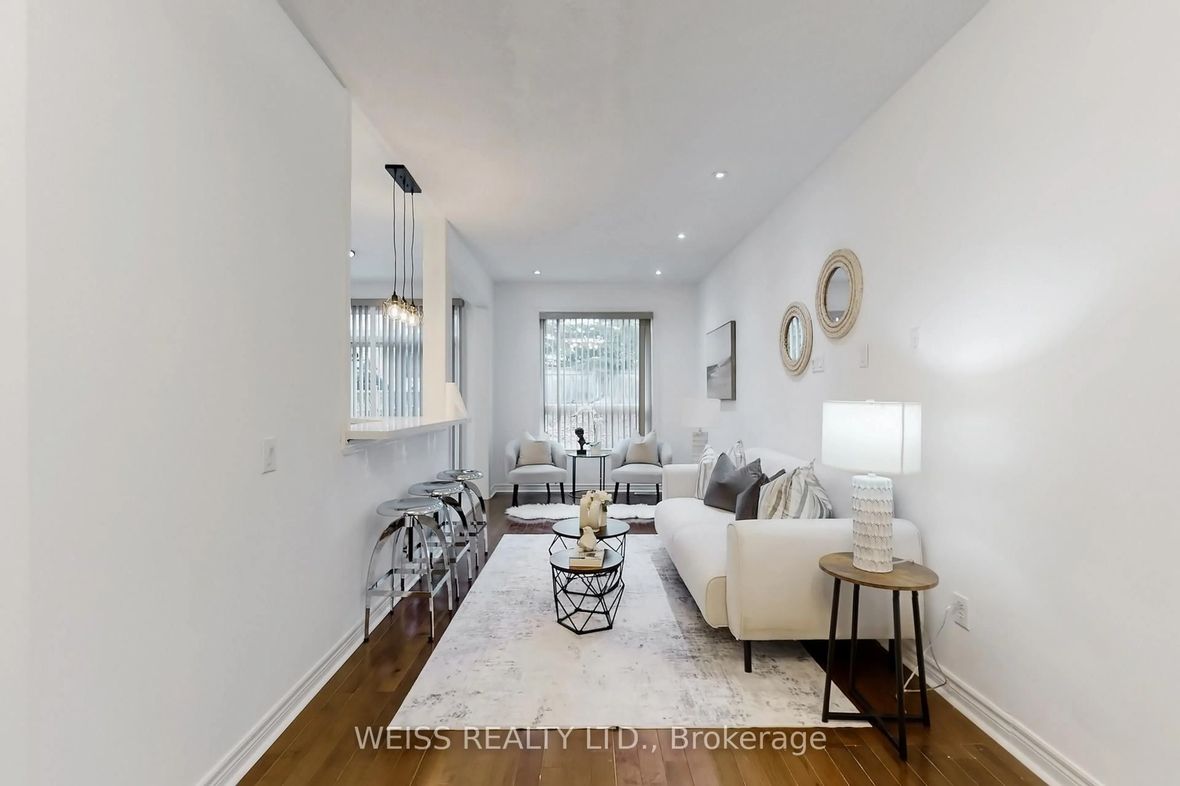 Living room with furniture, wood/laminate floor for 942 Khan Cres, Mississauga Ontario L5V 2P7