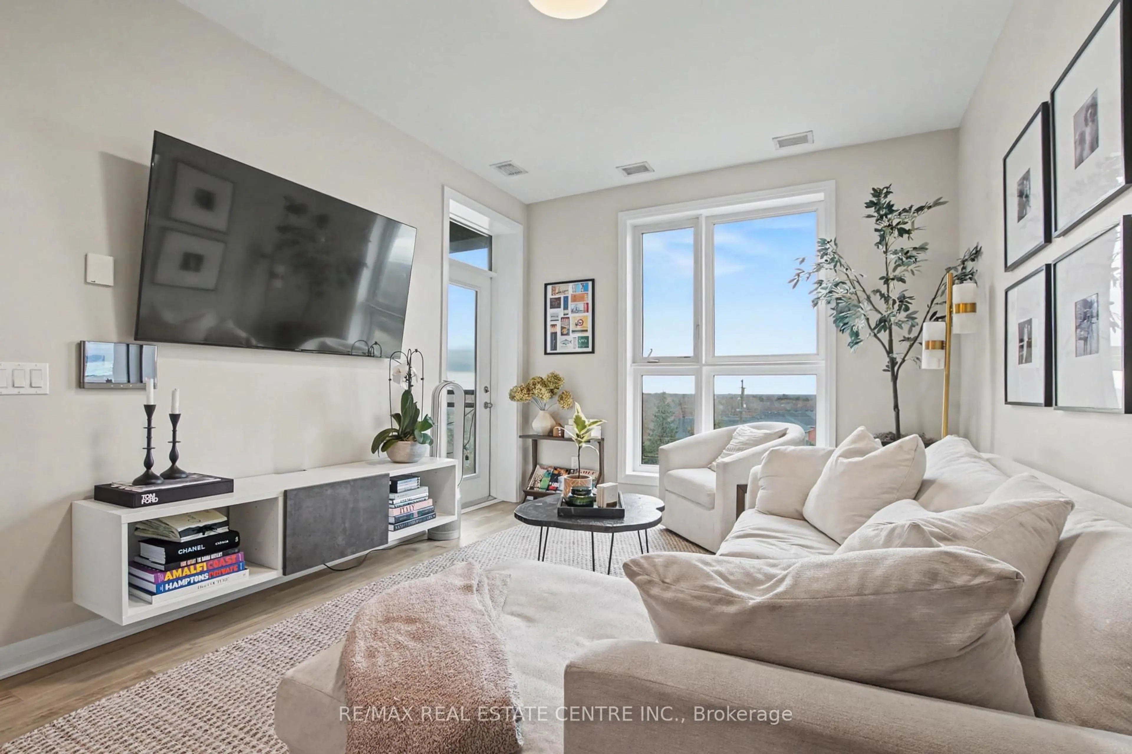 Living room with furniture, unknown for 95 Dundas St #309, Oakville Ontario L6M 5N4