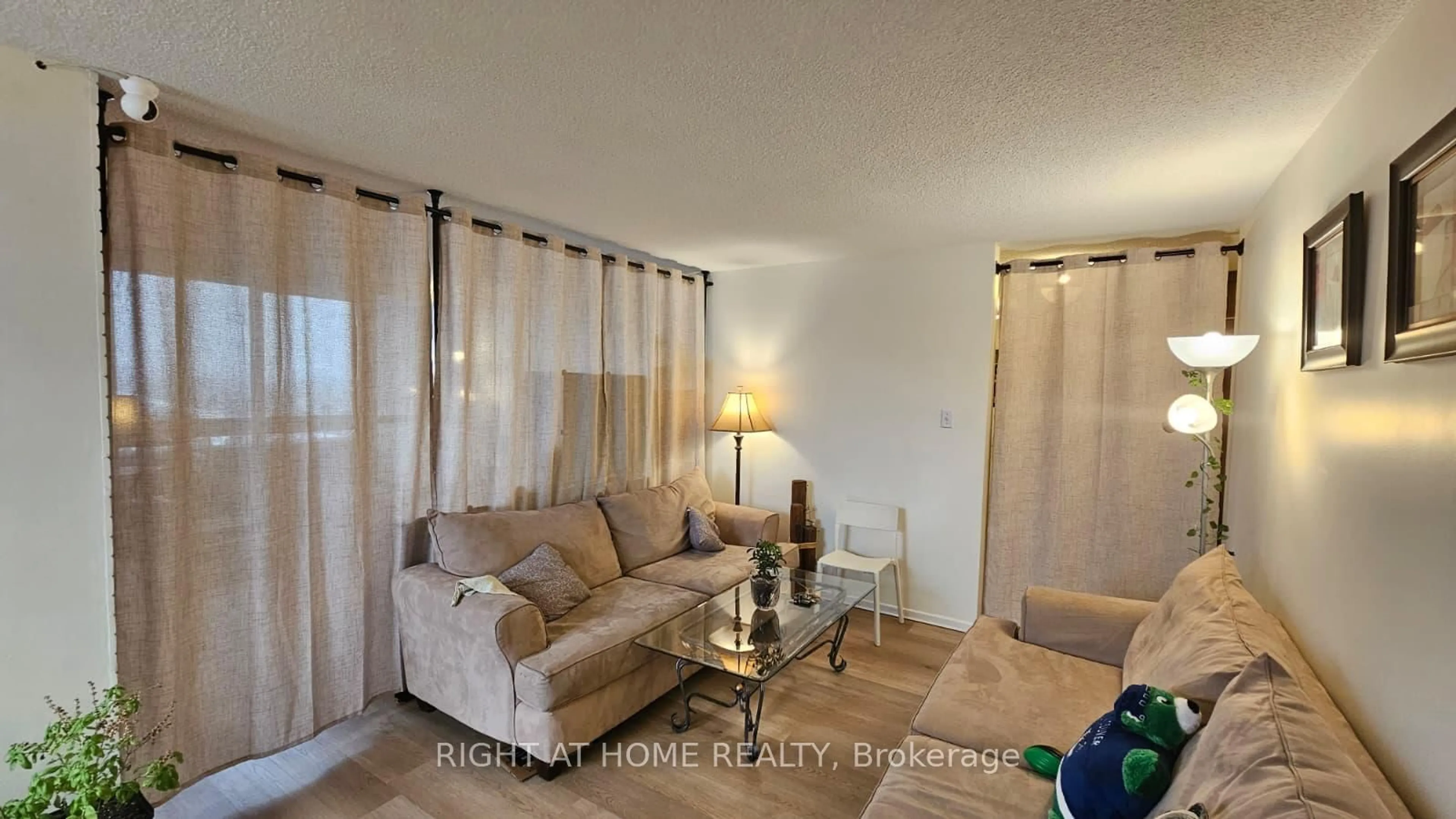 Living room with furniture, unknown for 25 Kensington Rd #1912, Brampton Ontario L6T 3W8