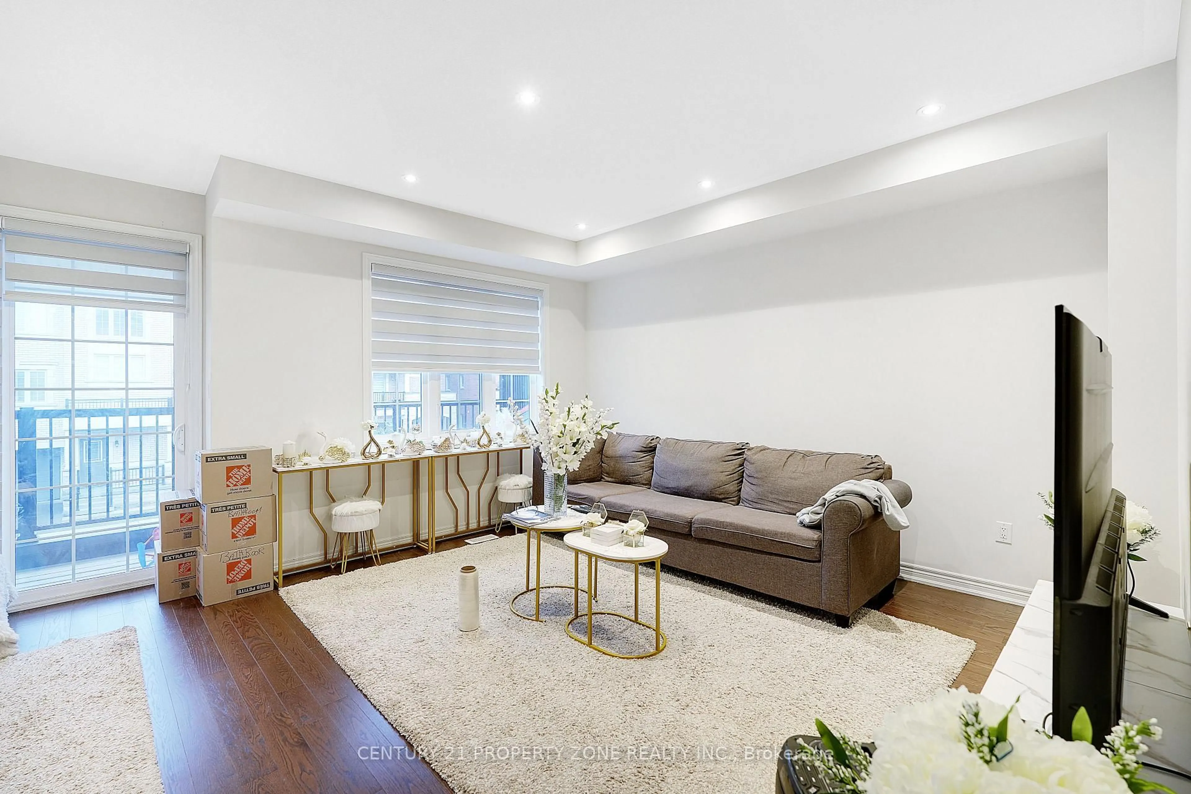 Living room with furniture, wood/laminate floor for 25 Hashmi Pl, Brampton Ontario L6Y 0H8