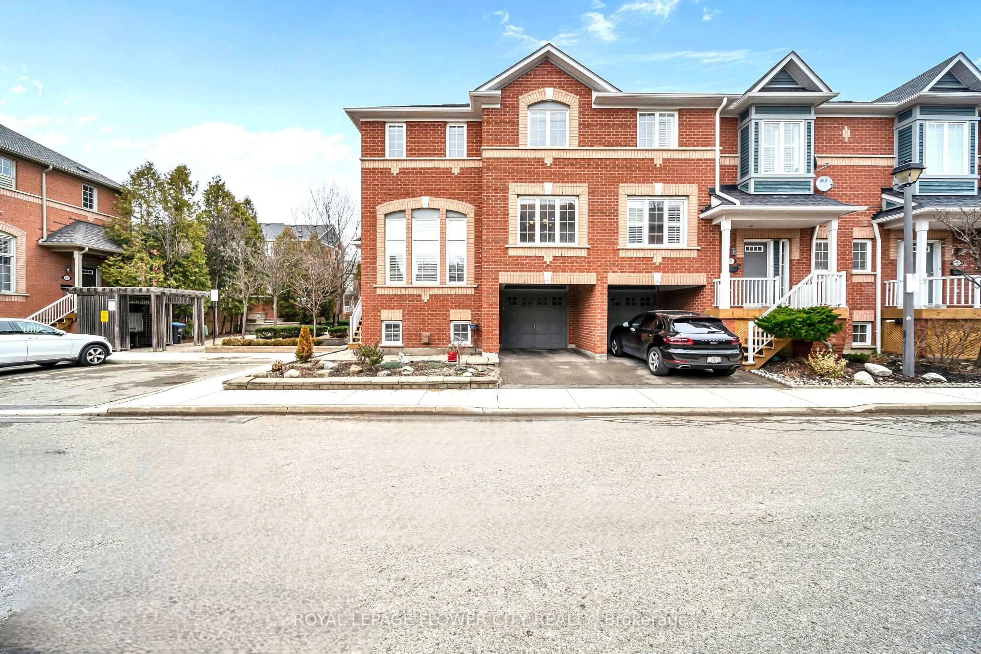 Home with brick exterior material, street for 5031 E Mill Rd #1, Mississauga Ontario L5V 2M5