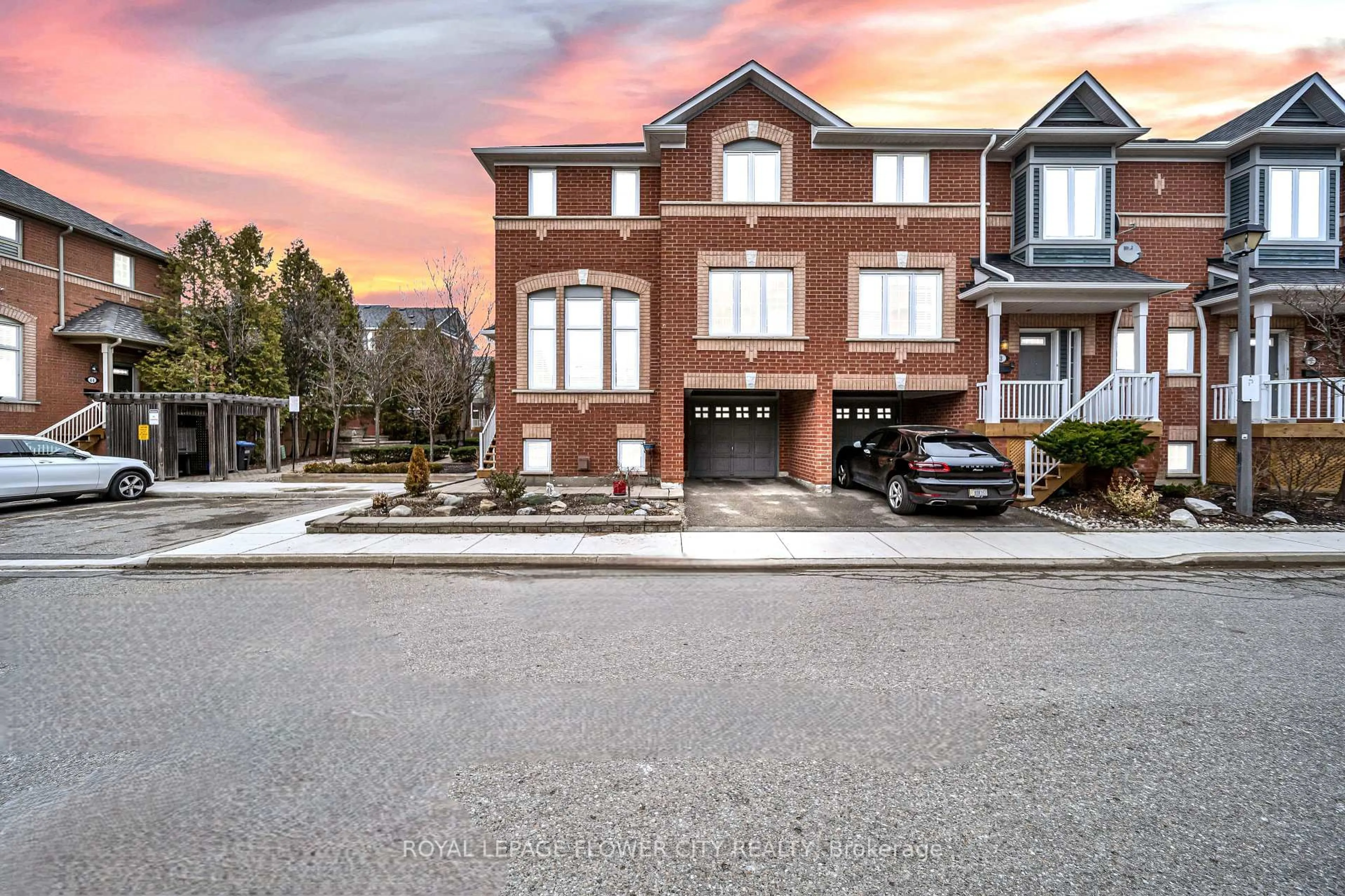 Home with brick exterior material, street for 5031 E Mill Rd #1, Mississauga Ontario L5V 2M5