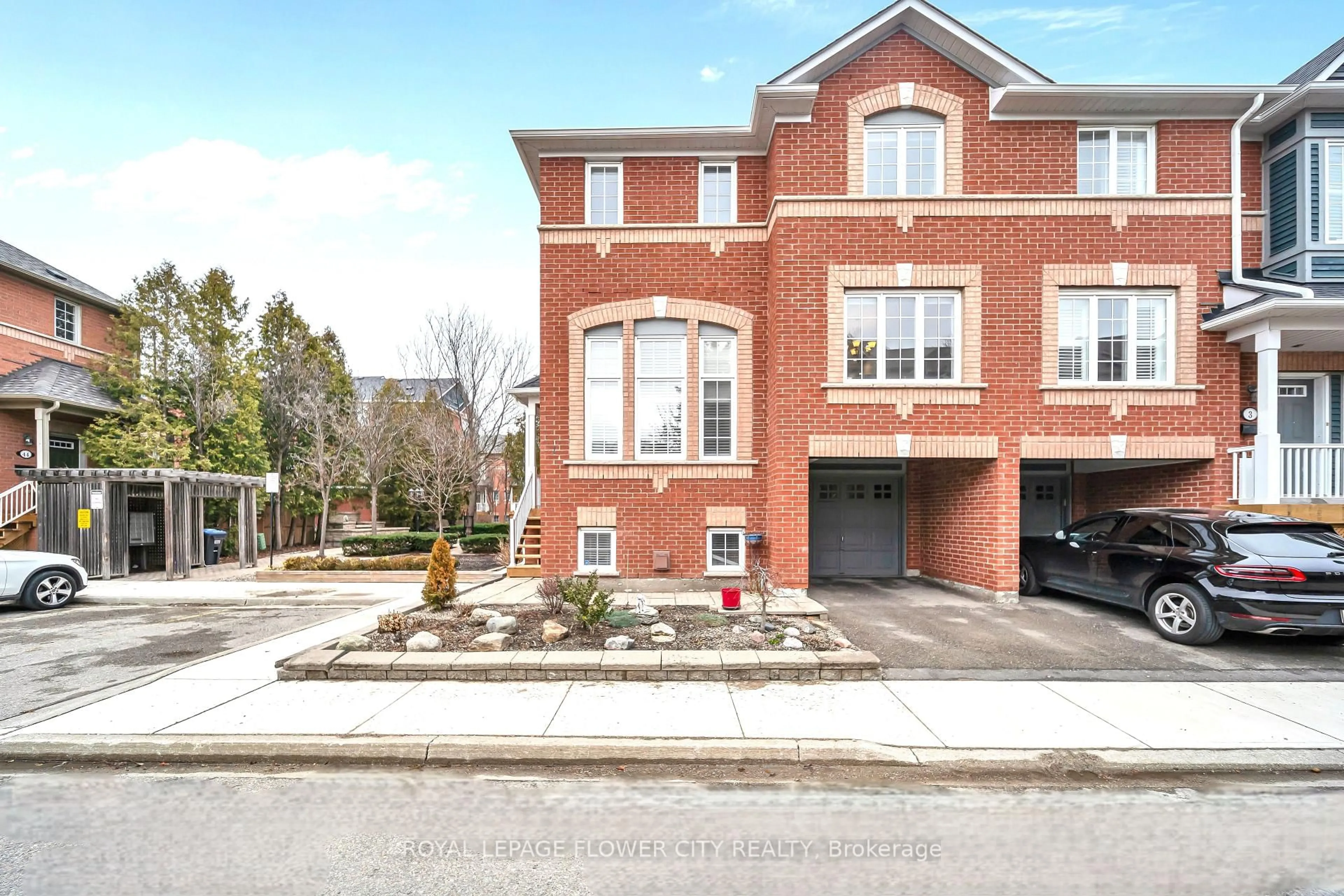 Home with brick exterior material, street for 5031 E Mill Rd #1, Mississauga Ontario L5V 2M5
