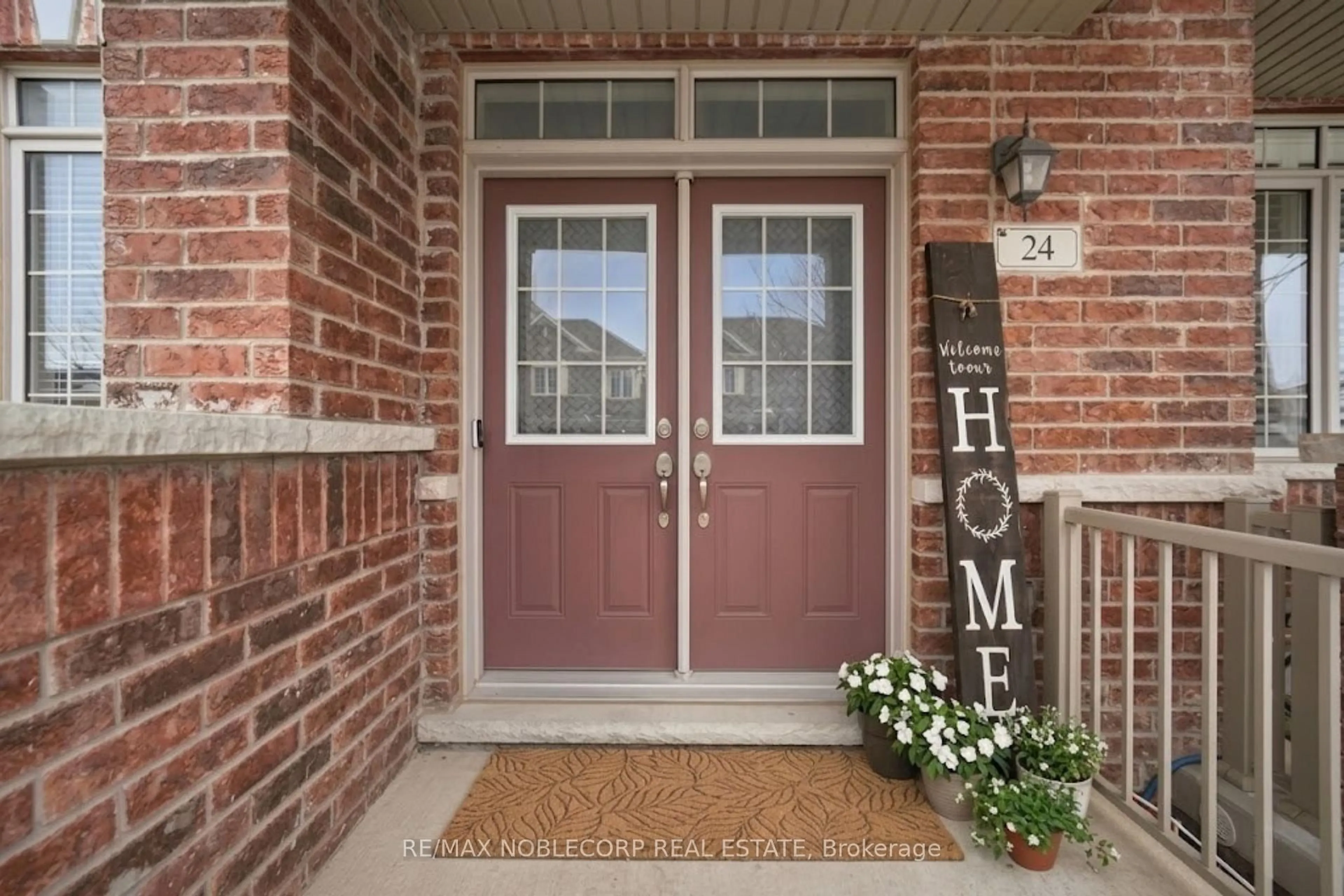 Home with brick exterior material, street for 24 Primo Rd, Brampton Ontario L7A 3Y1