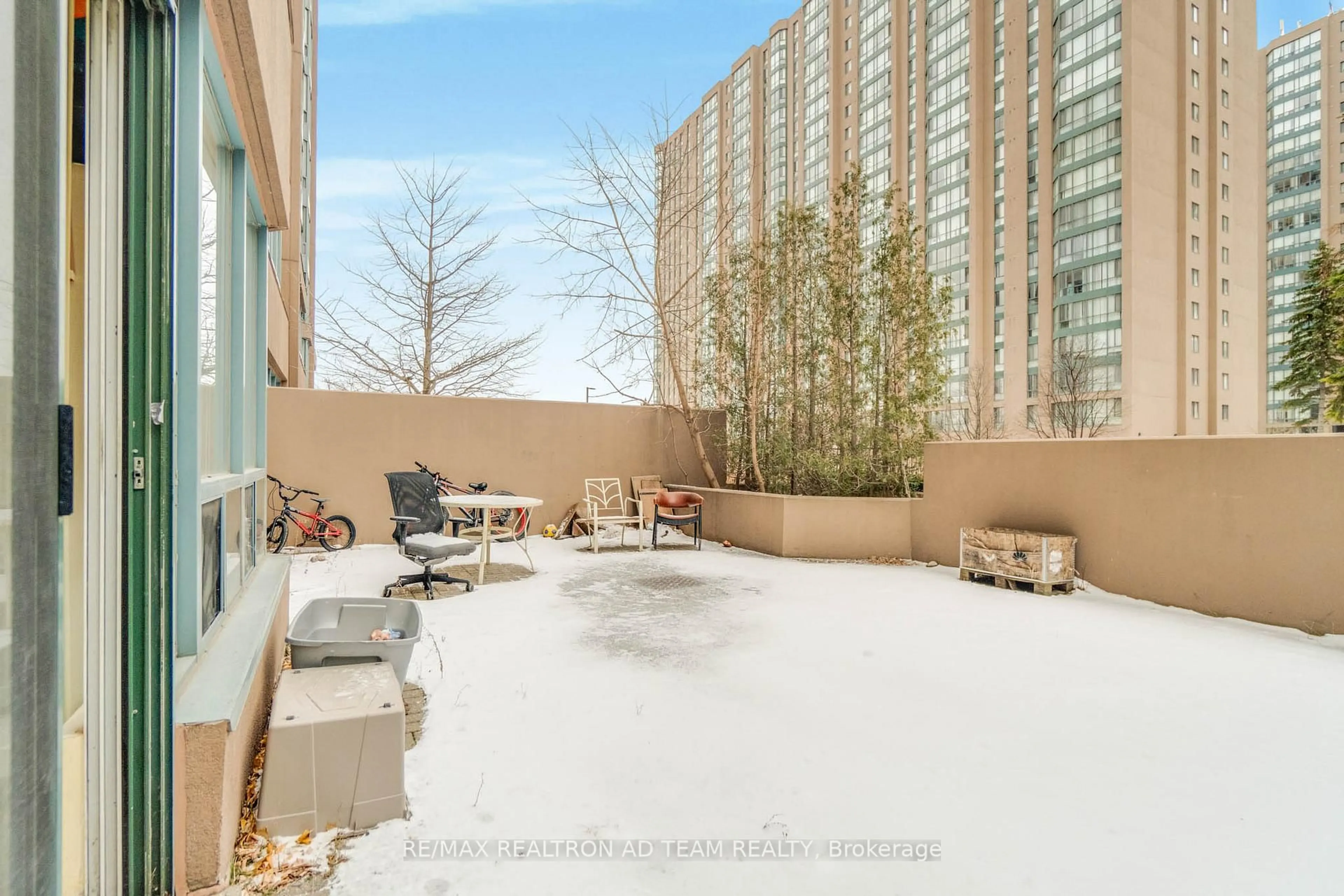 Patio, city buildings view from balcony for 115 Hillcrest Ave #110, Mississauga Ontario L5B 3Y9