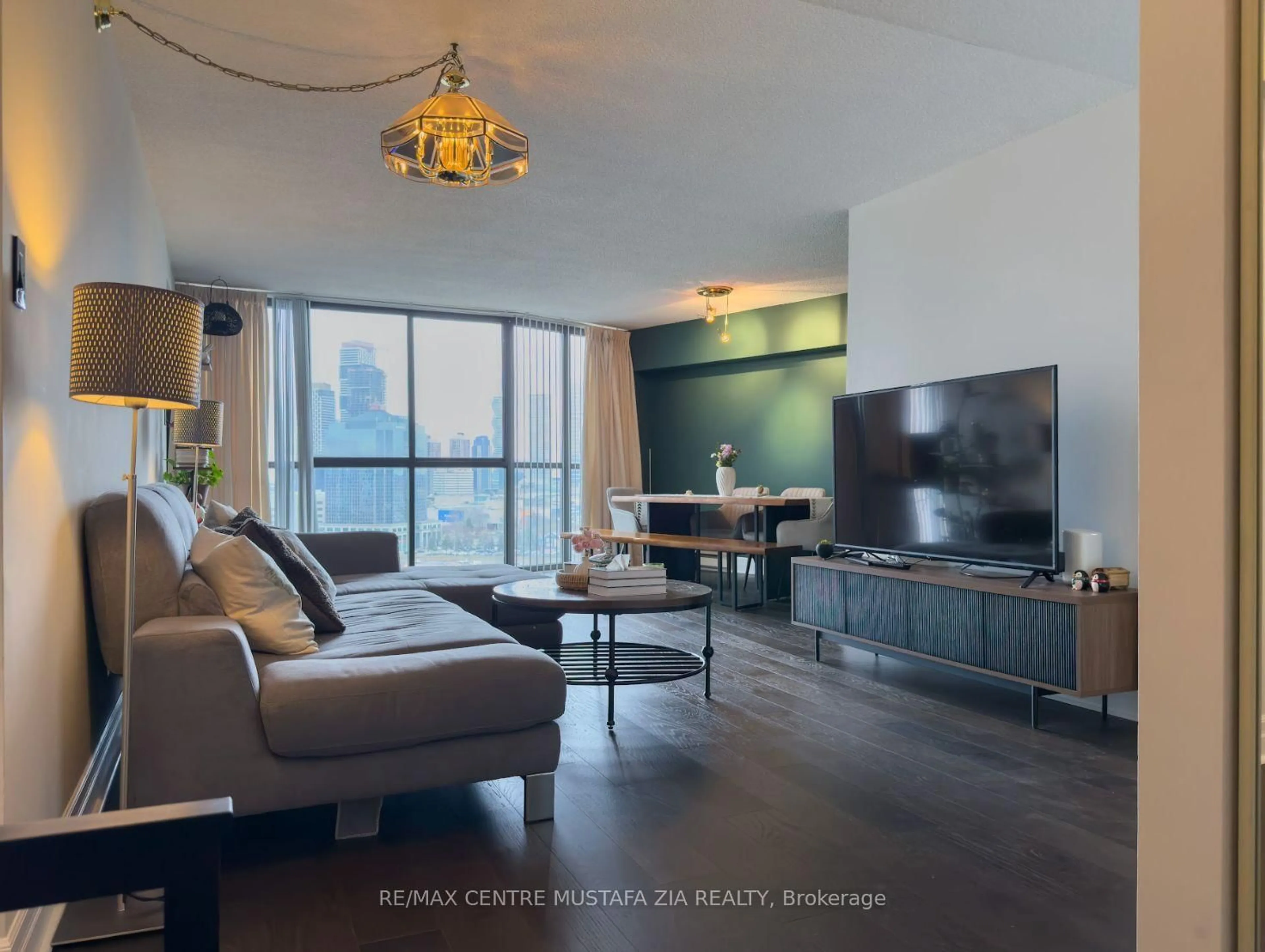 Living room with furniture, wood/laminate floor for 4235 Sherwoodtowne Blvd #1405, Mississauga Ontario L4Z 1W3