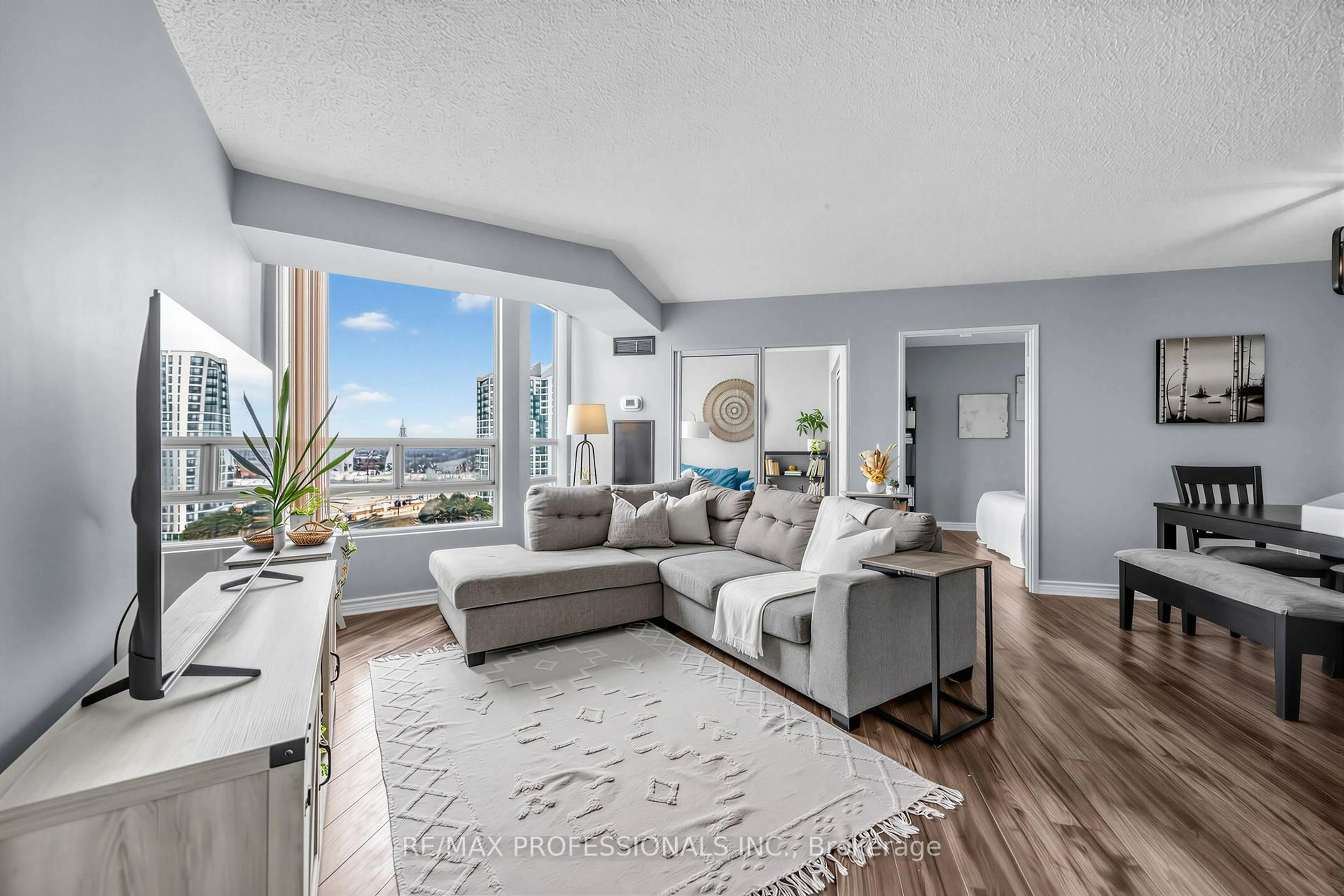 Living room with furniture, unknown for 50 Kingsbridge Garden Circ #1410, Mississauga Ontario L5R 1Y2