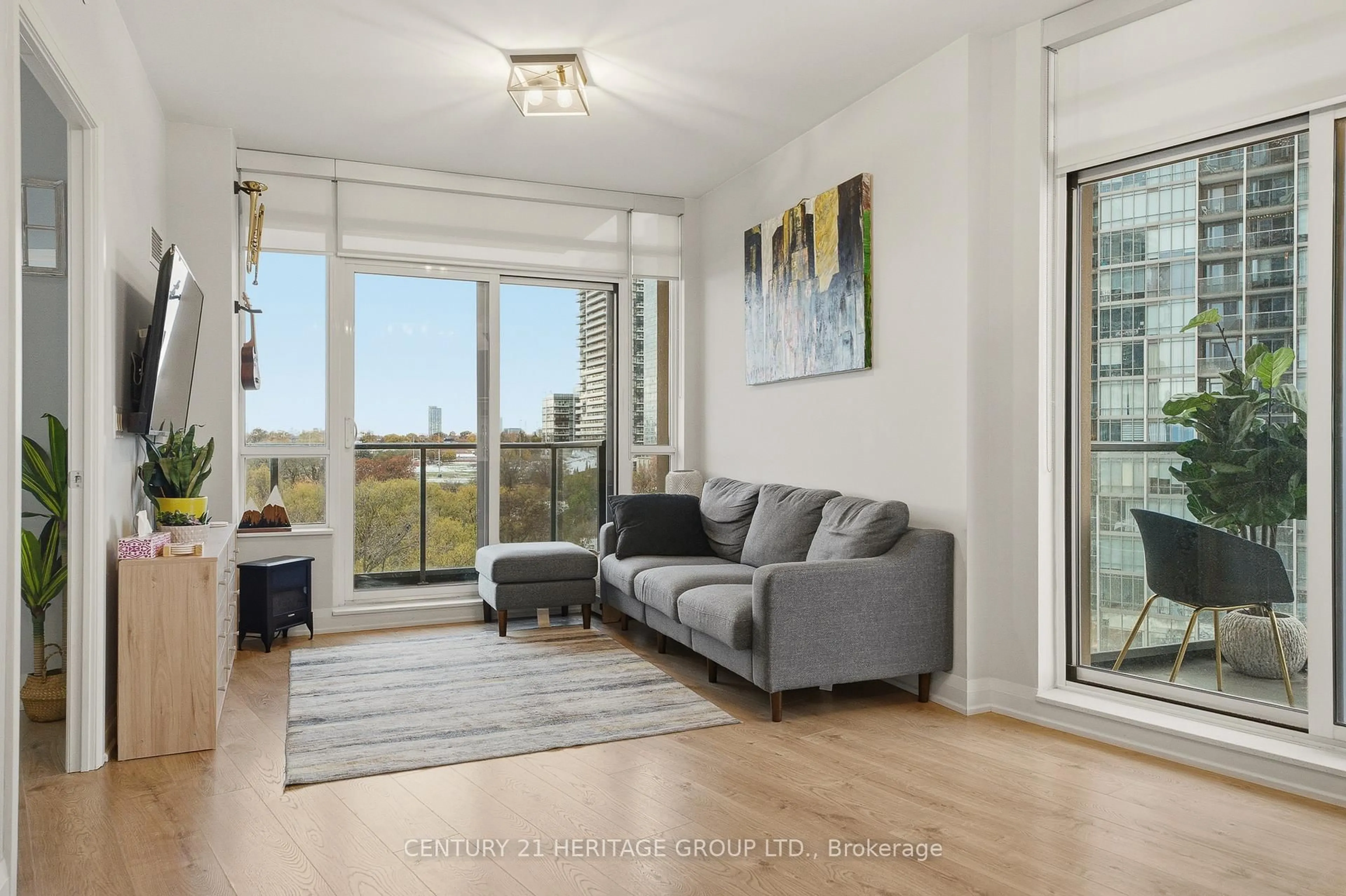 Living room with furniture, wood/laminate floor for 36 Park Lawn Rd #605, Toronto Ontario M8V 0E5