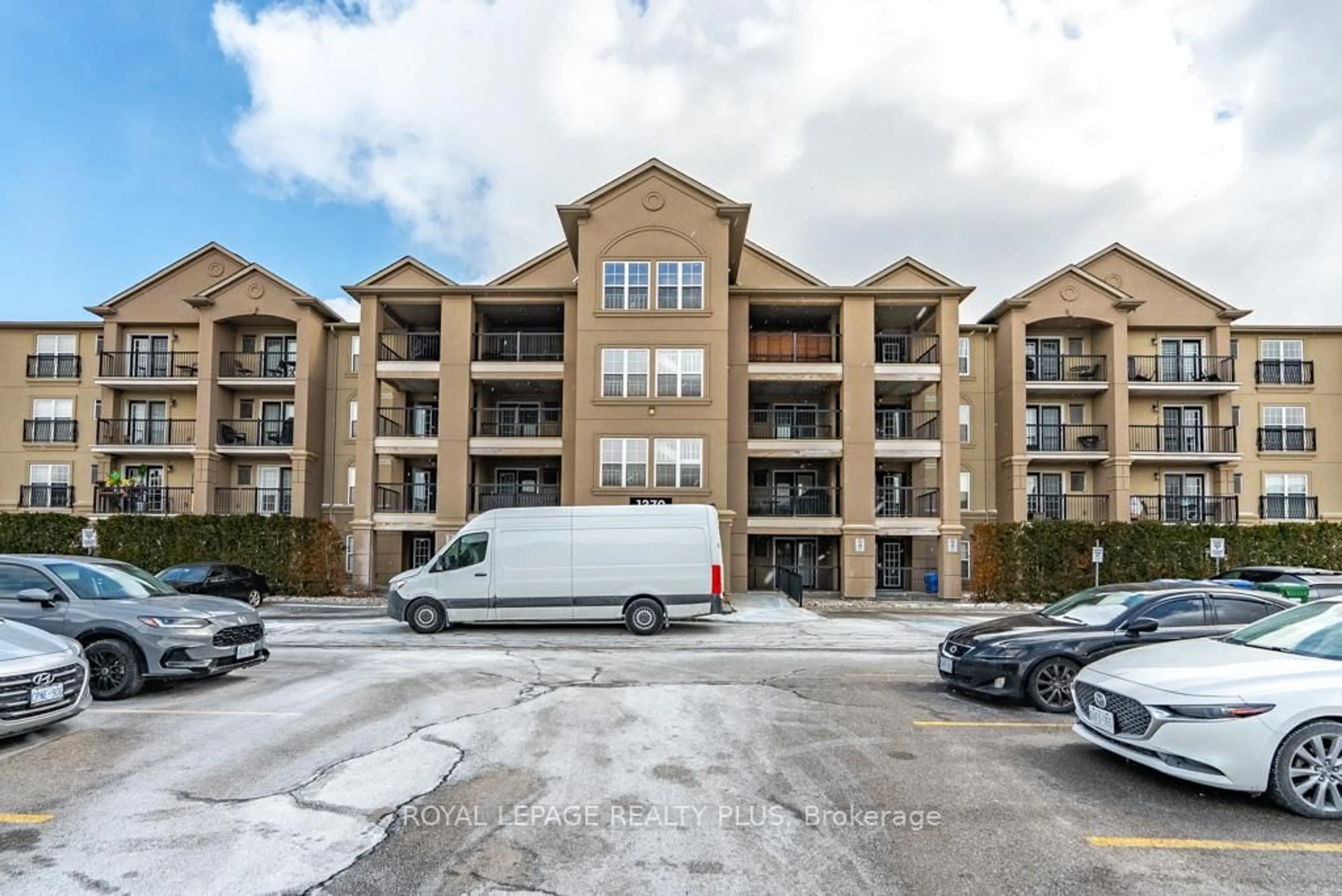 A pic from outside/outdoor area/front of a property/back of a property/a pic from drone, unknown for 1370 Main St #309, Milton Ontario L9T 7S8