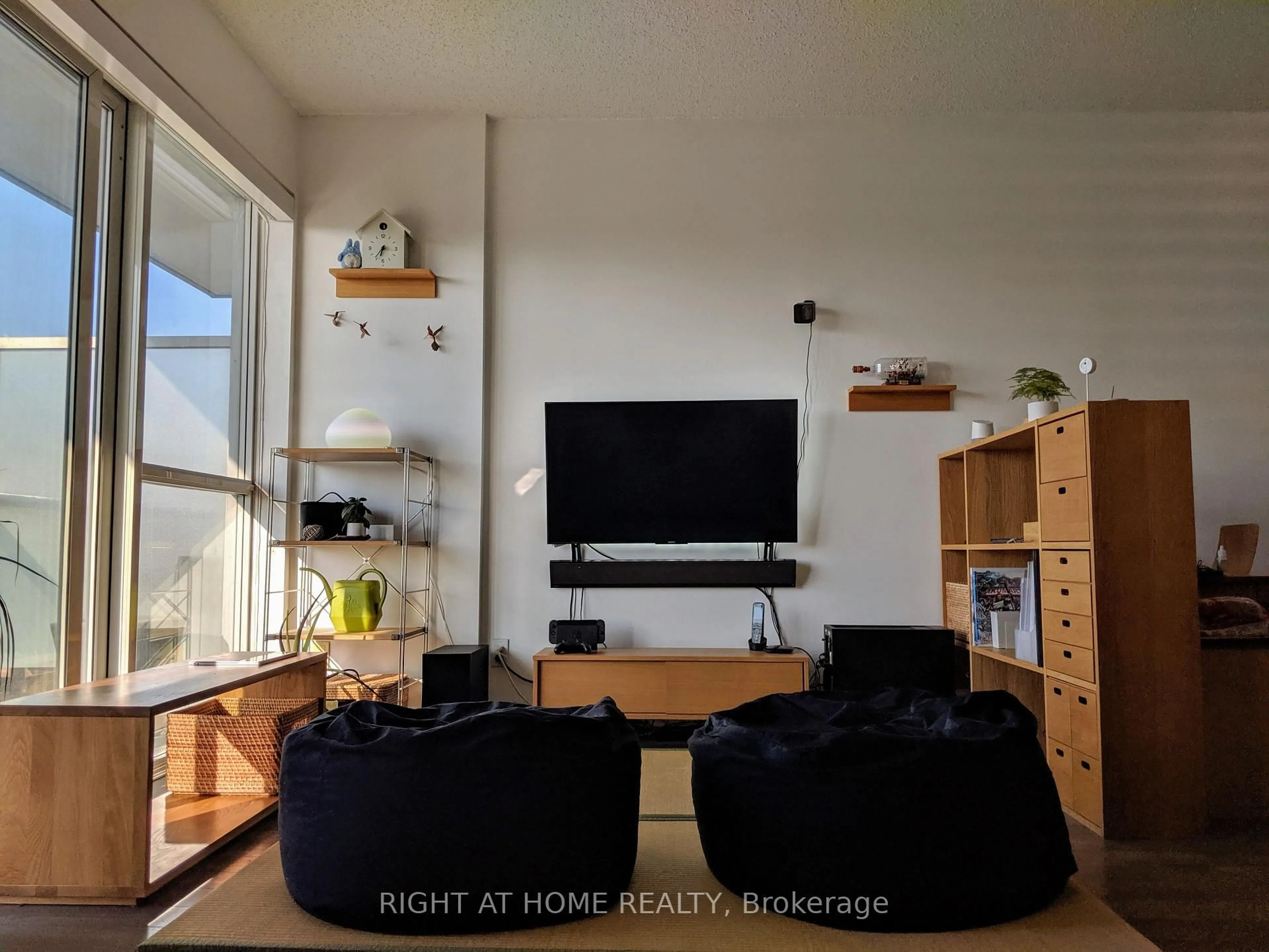 Living room with furniture, wood/laminate floor for 15 James Finlay Way #612, Toronto Ontario M3M 0B3