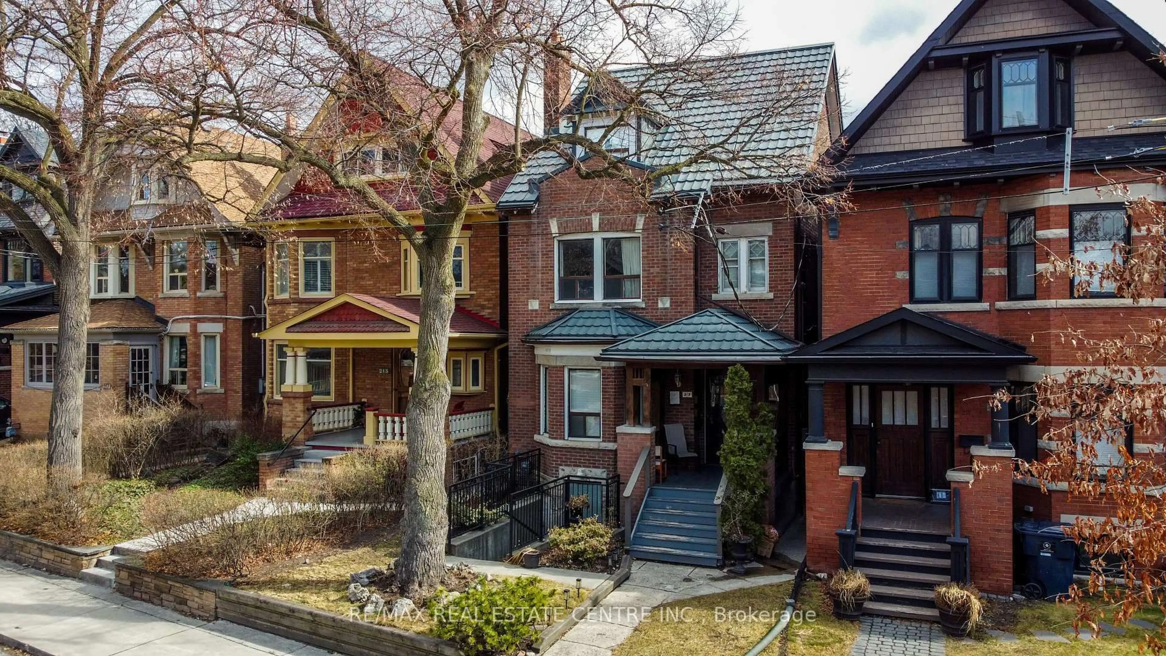 Home with brick exterior material, street for 213 Indian Rd, Toronto Ontario M6R 2W7