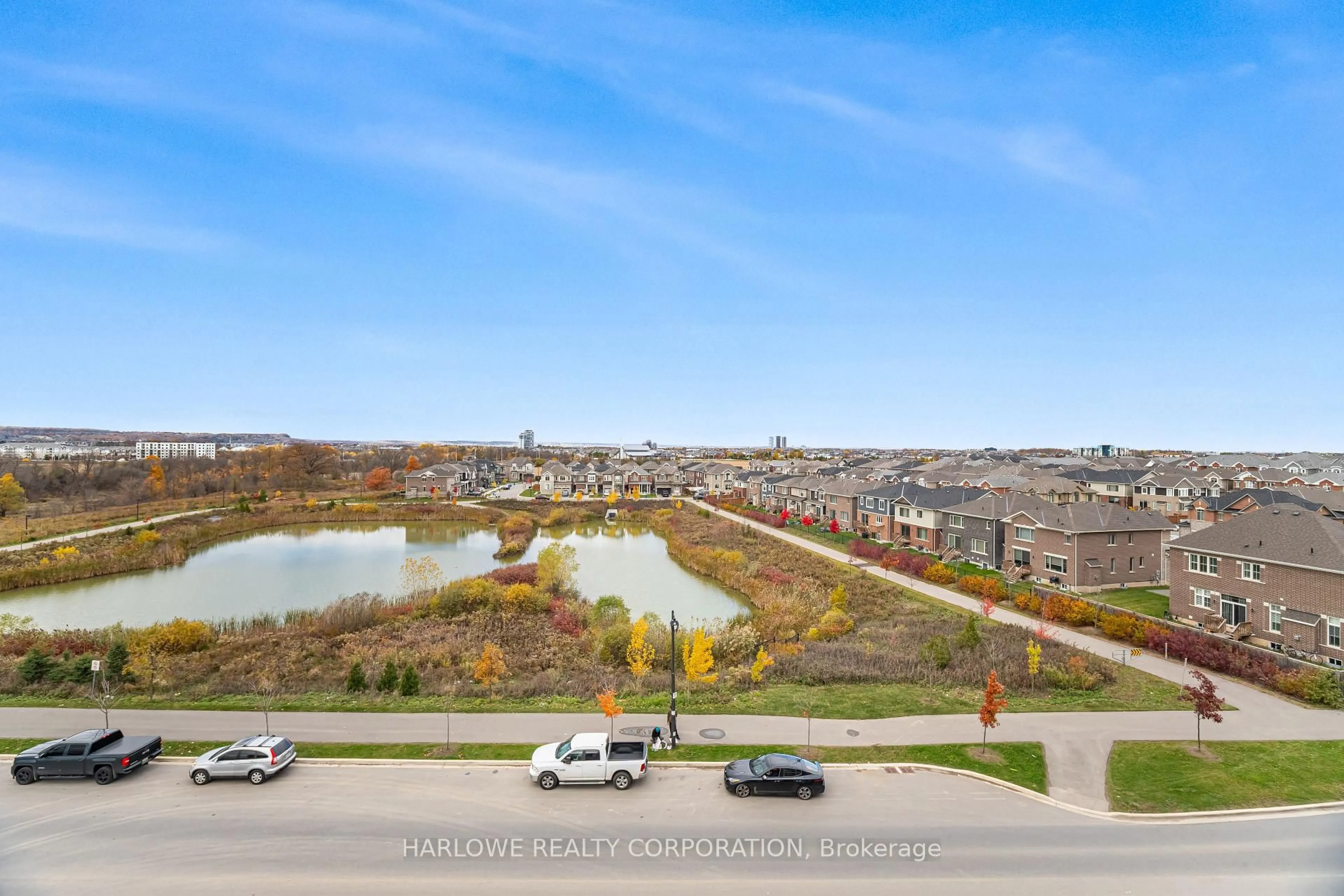 A pic from outside/outdoor area/front of a property/back of a property/a pic from drone, water/lake/river/ocean view for 720 Whitlock Ave #312, Milton Ontario L9E 2B5