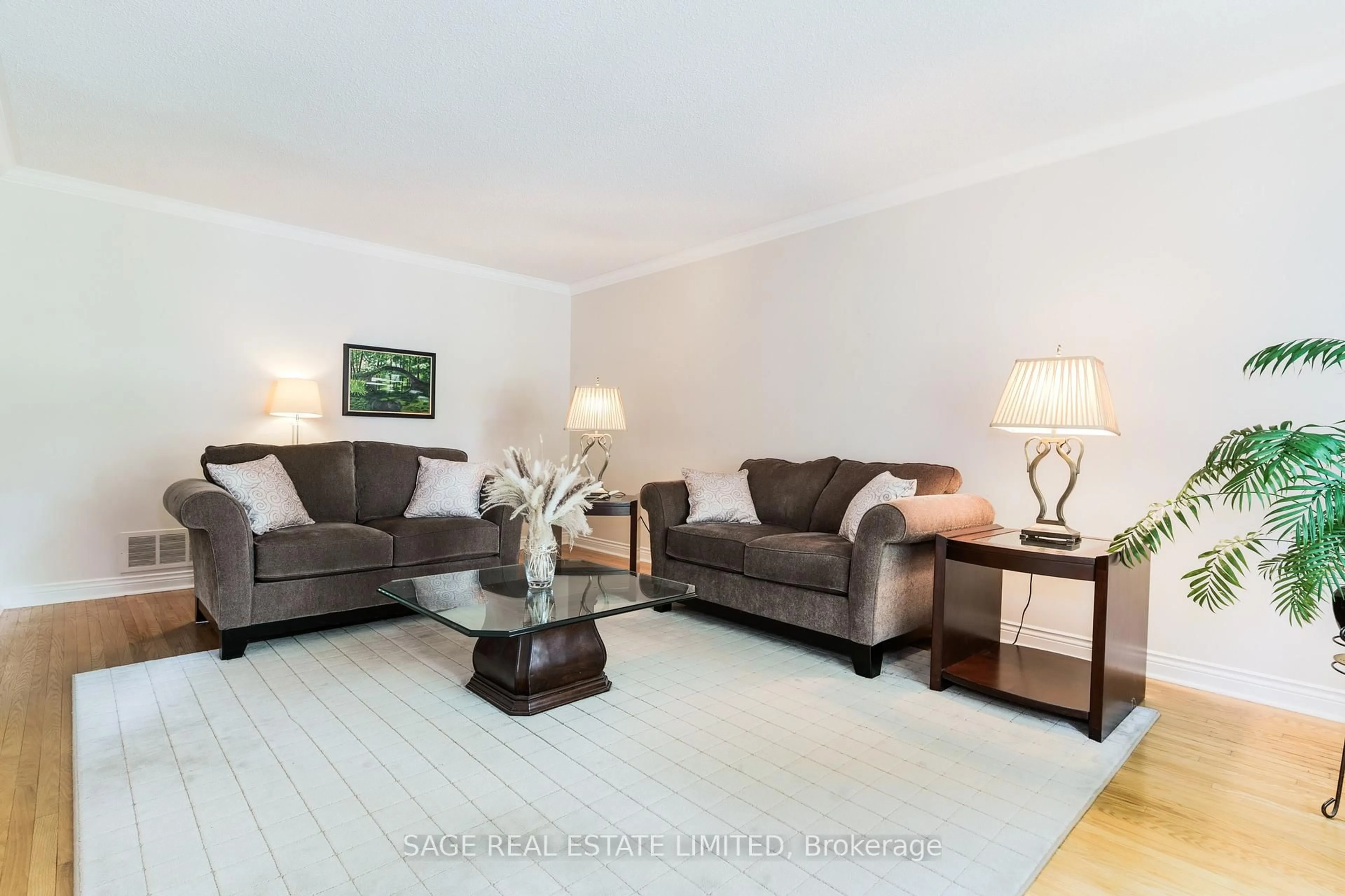 Living room with furniture, wood/laminate floor for 1859 Sherwood Forrest Circ, Mississauga Ontario L5K 2G6