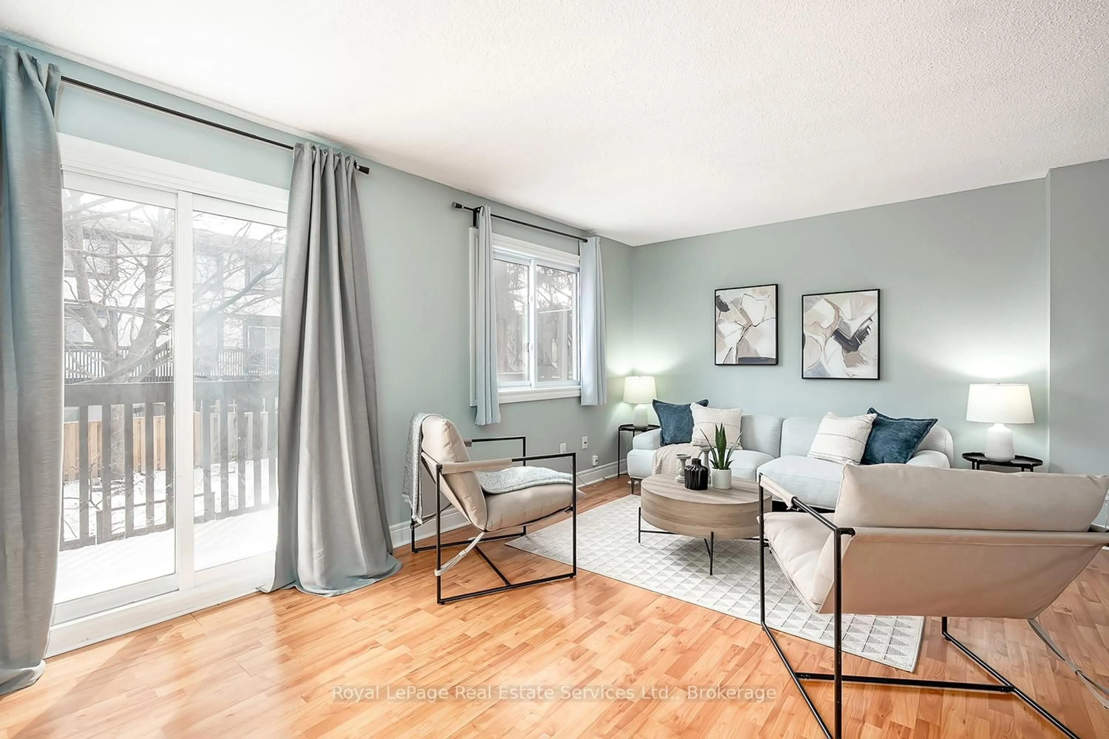 Living room with furniture, wood/laminate floor for 2651 Aquitaine Ave #24, Mississauga Ontario L5N 1V5