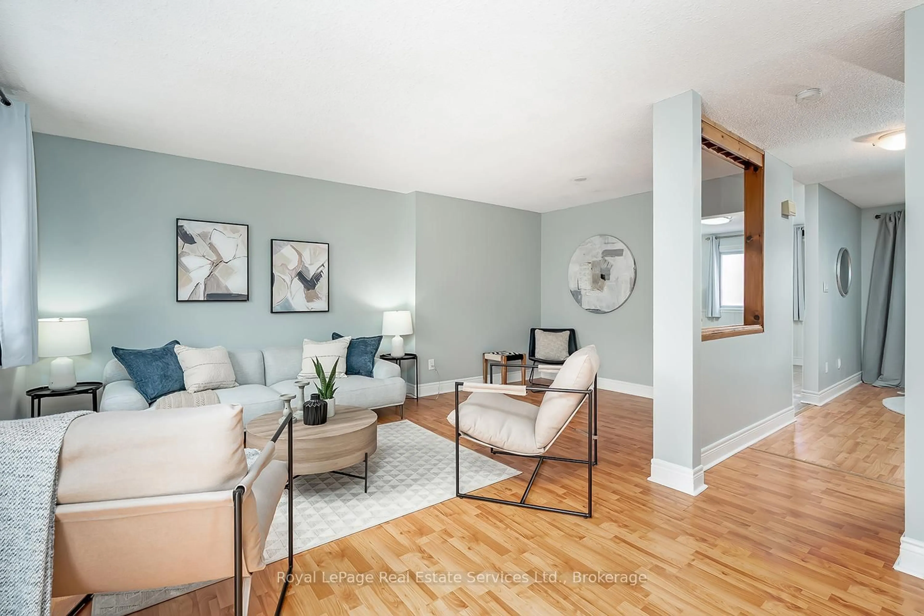 Living room with furniture, wood/laminate floor for 2651 Aquitaine Ave #24, Mississauga Ontario L5N 1V5