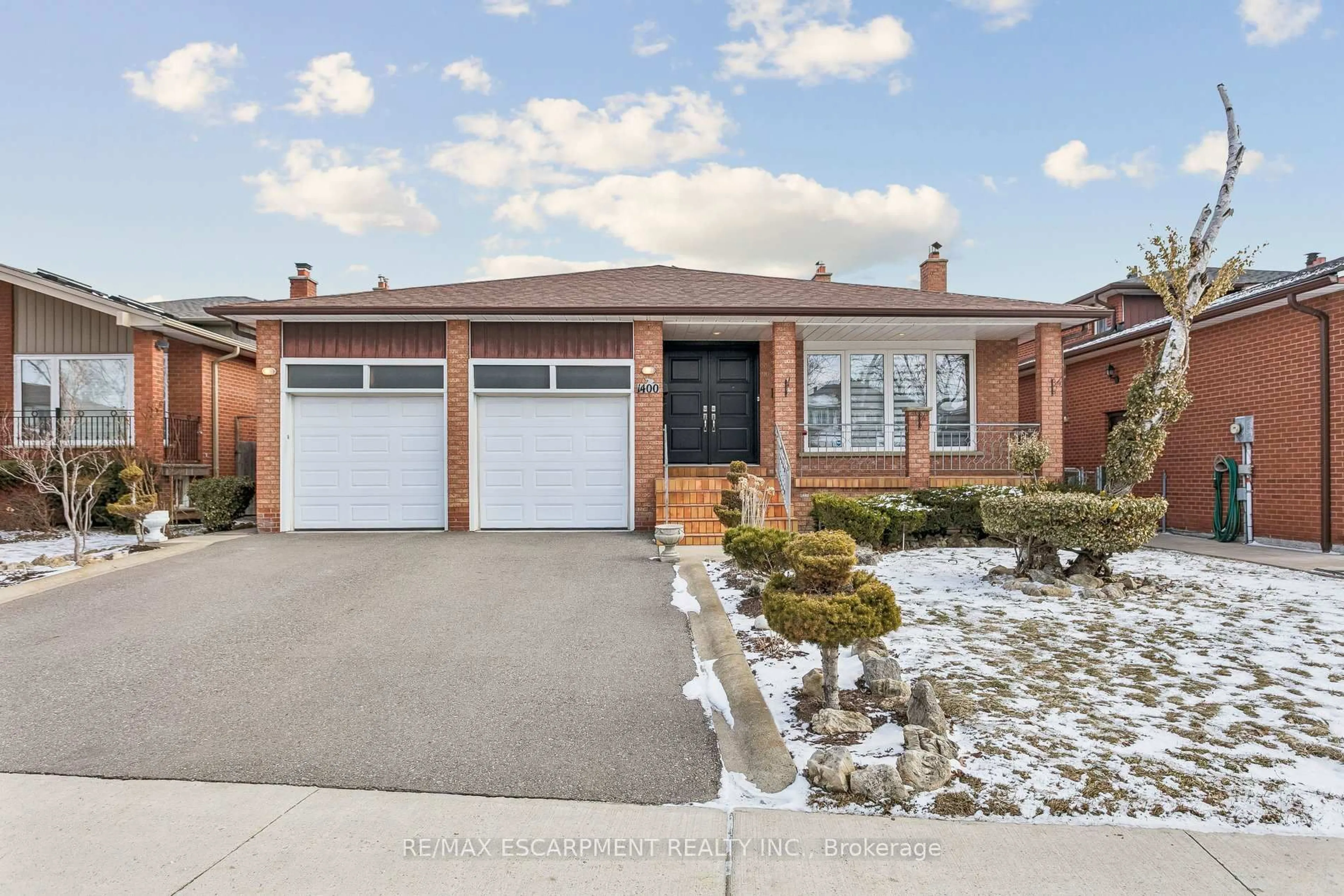 Home with brick exterior material, street for 1400 Bough Beeches Blvd, Mississauga Ontario L4W 3B5