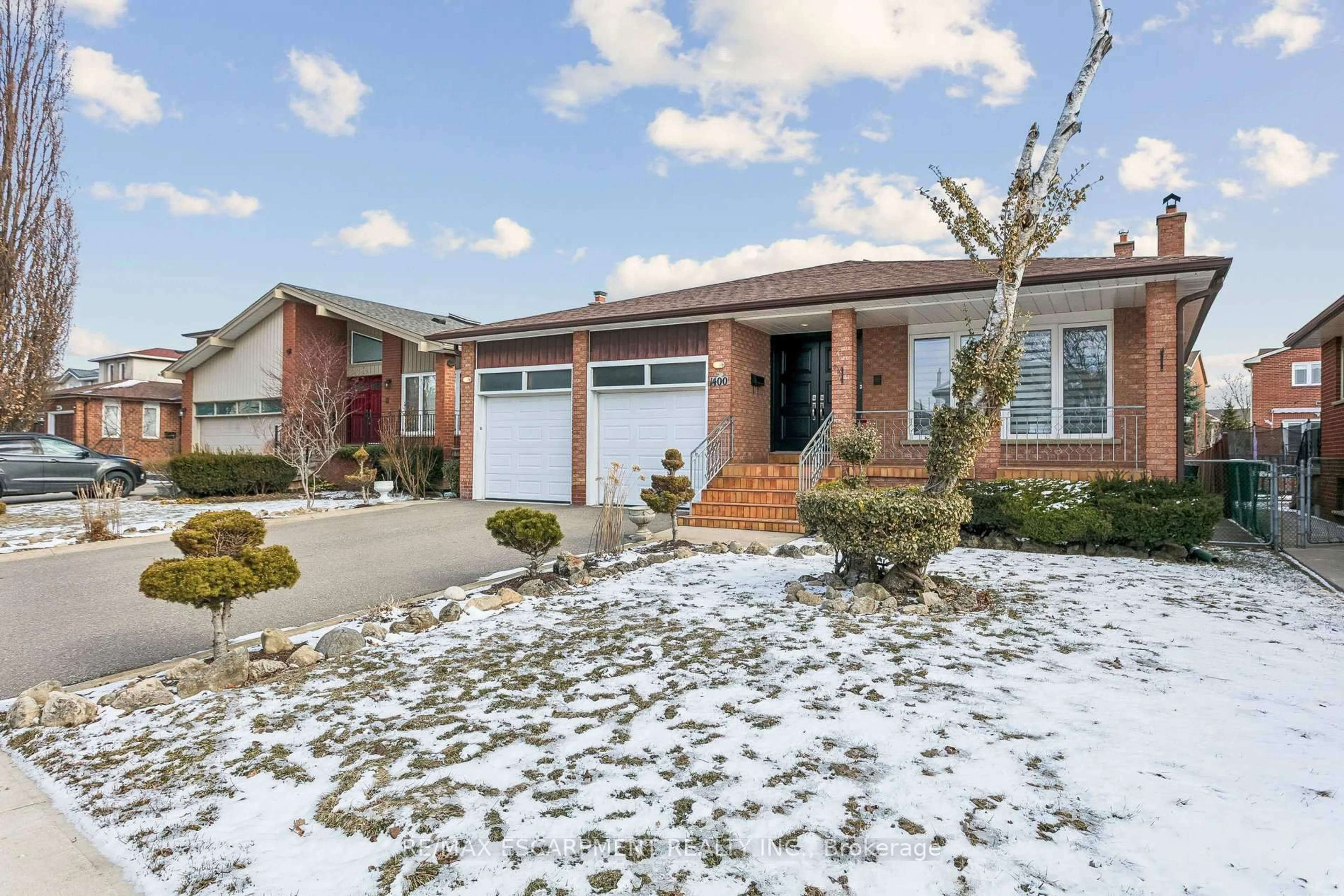 Home with brick exterior material, street for 1400 Bough Beeches Blvd, Mississauga Ontario L4W 3B5