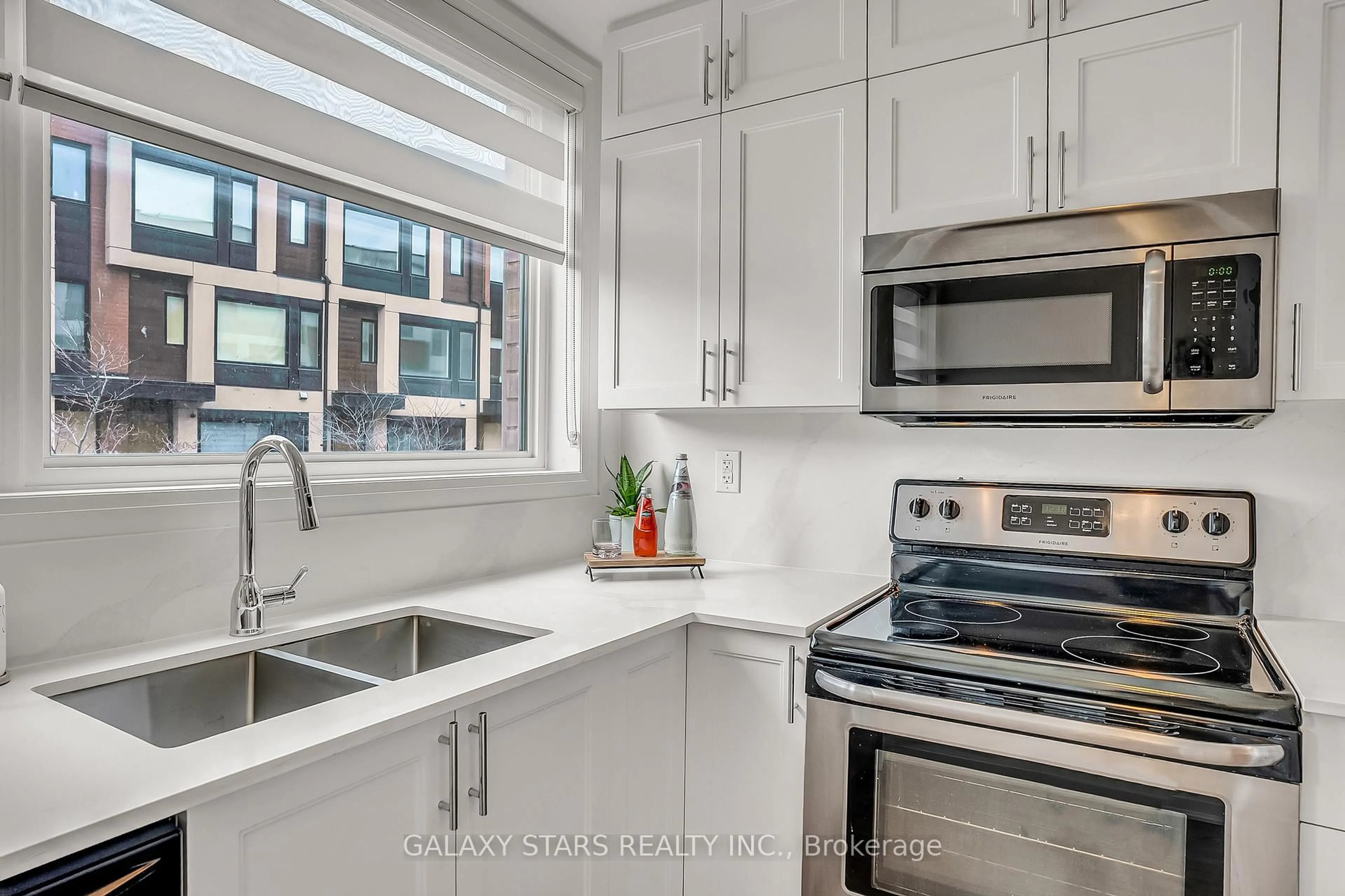 Open concept kitchen, ceramic/tile floor for 50 Thomas Mullholland Dr #2, Toronto Ontario M3K 0A6