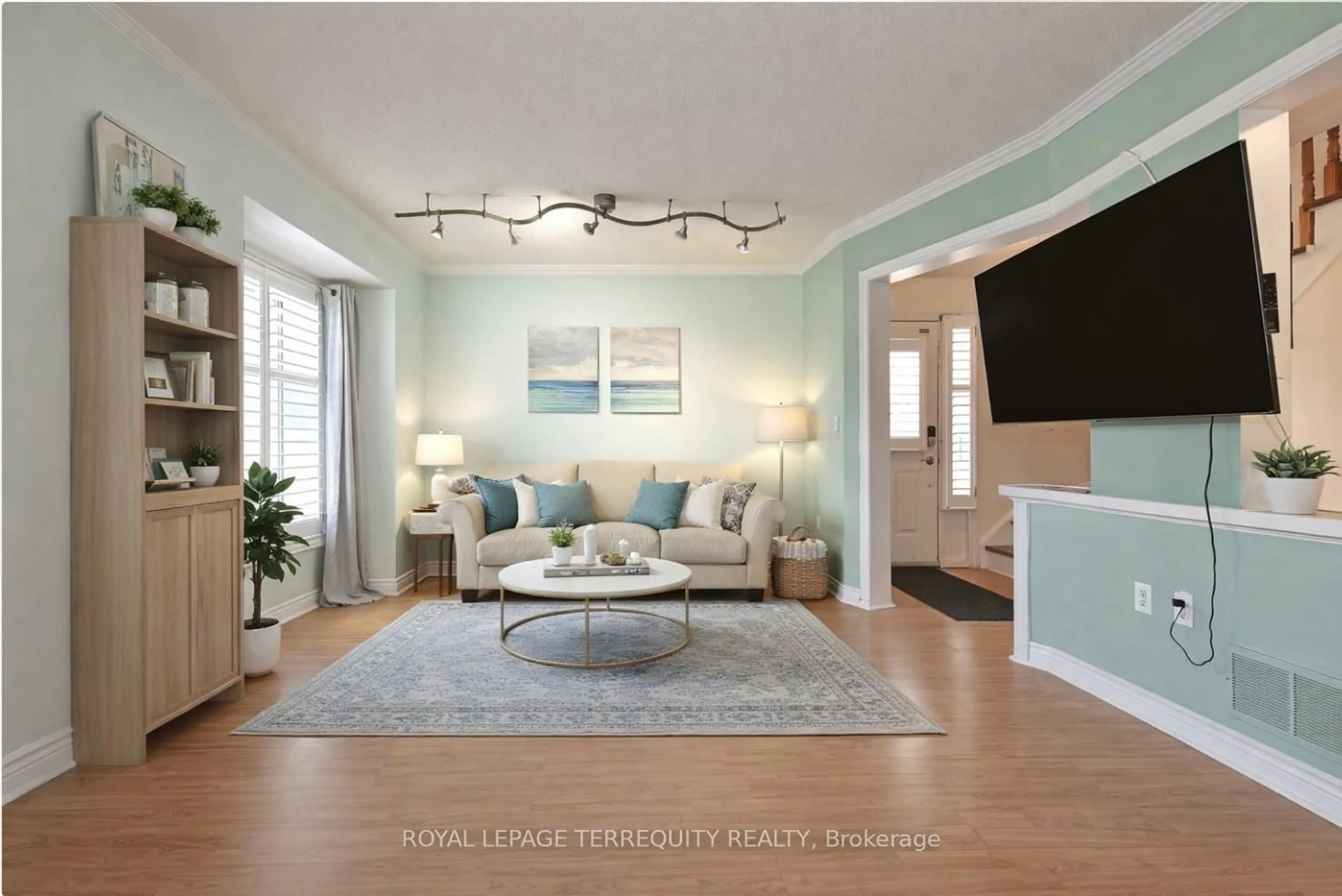 Living room with furniture, wood/laminate floor for 154 Pressed Brick Dr, Brampton Ontario L6V 4K6