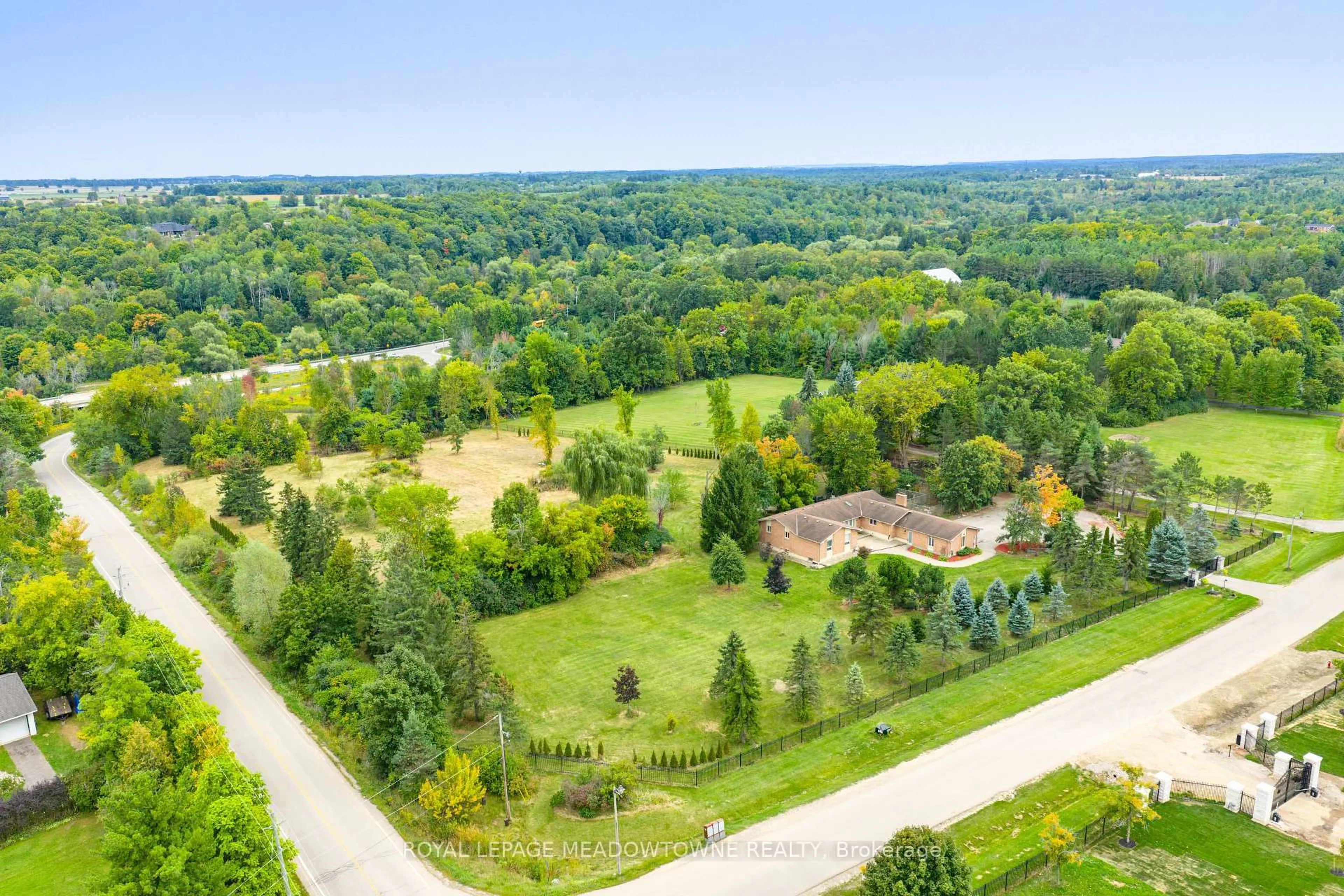 A pic from outside/outdoor area/front of a property/back of a property/a pic from drone, forest/trees view for 1 Cassidy Lane, Caledon Ontario L7C 1P5