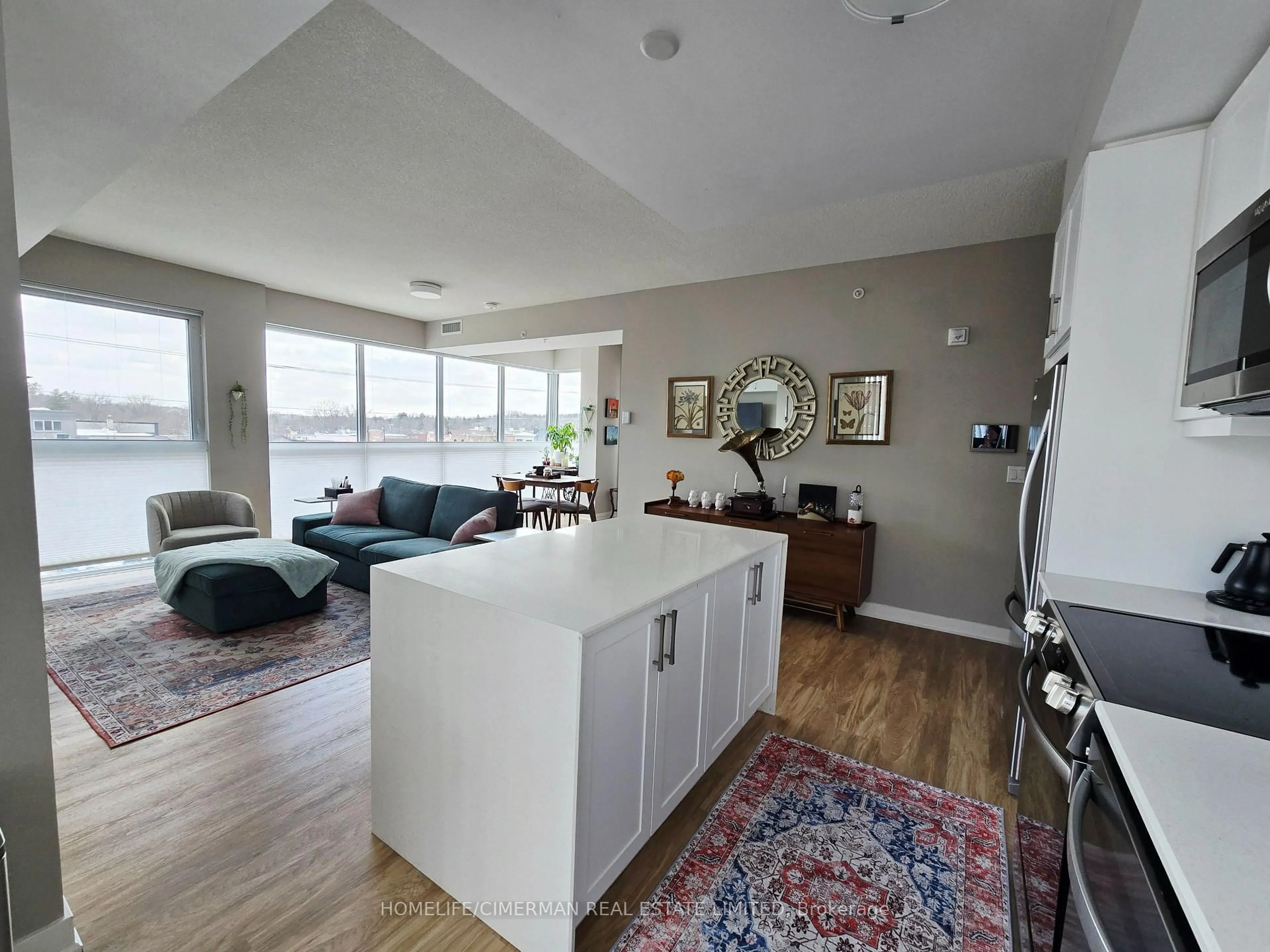 Open concept kitchen, wood/laminate floor for 50 Ann St #314, Caledon Ontario L7E 1B9