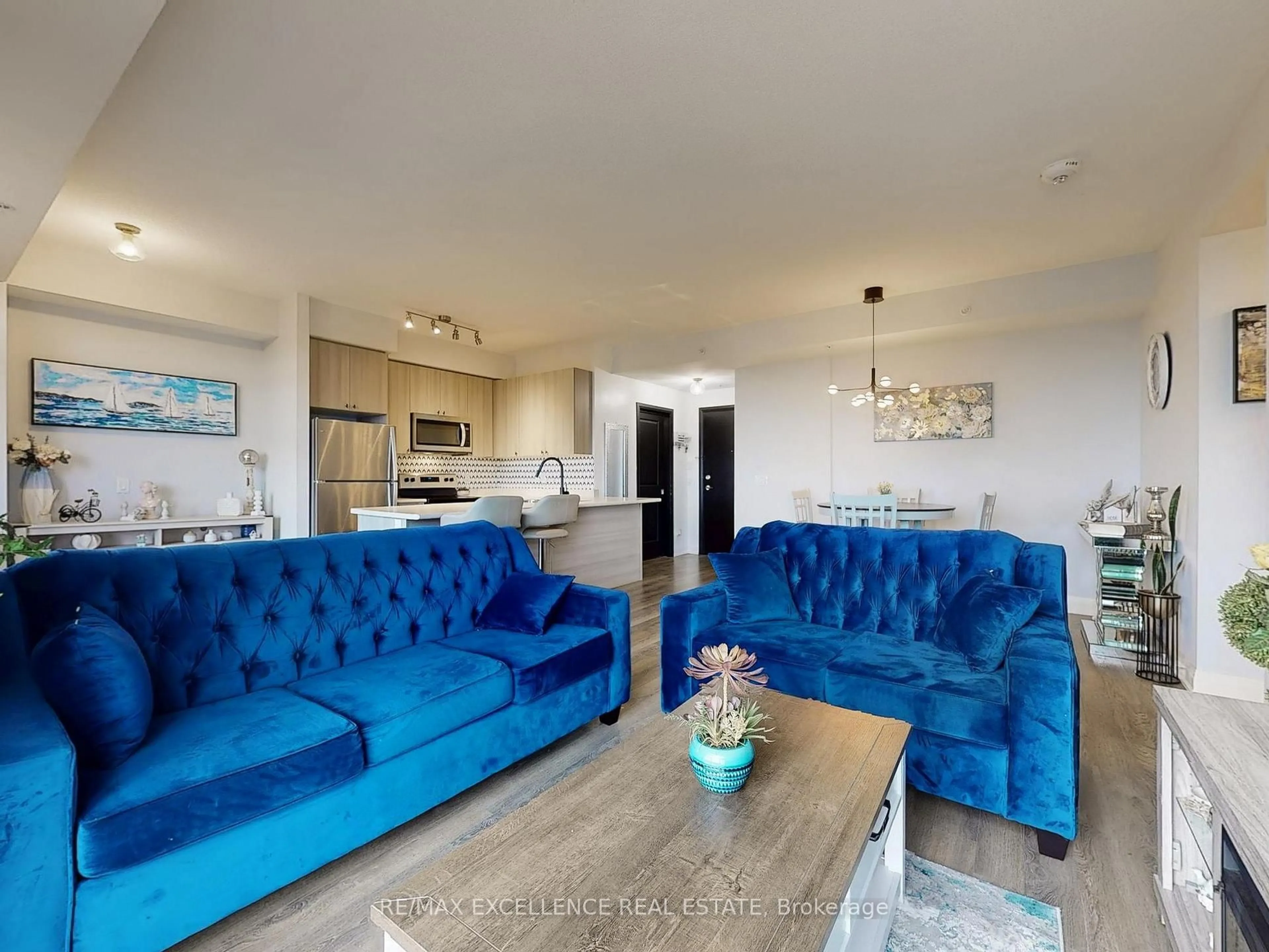 Living room with furniture, unknown for 65 Yorkland Blvd #309, Brampton Ontario L6P 4M5