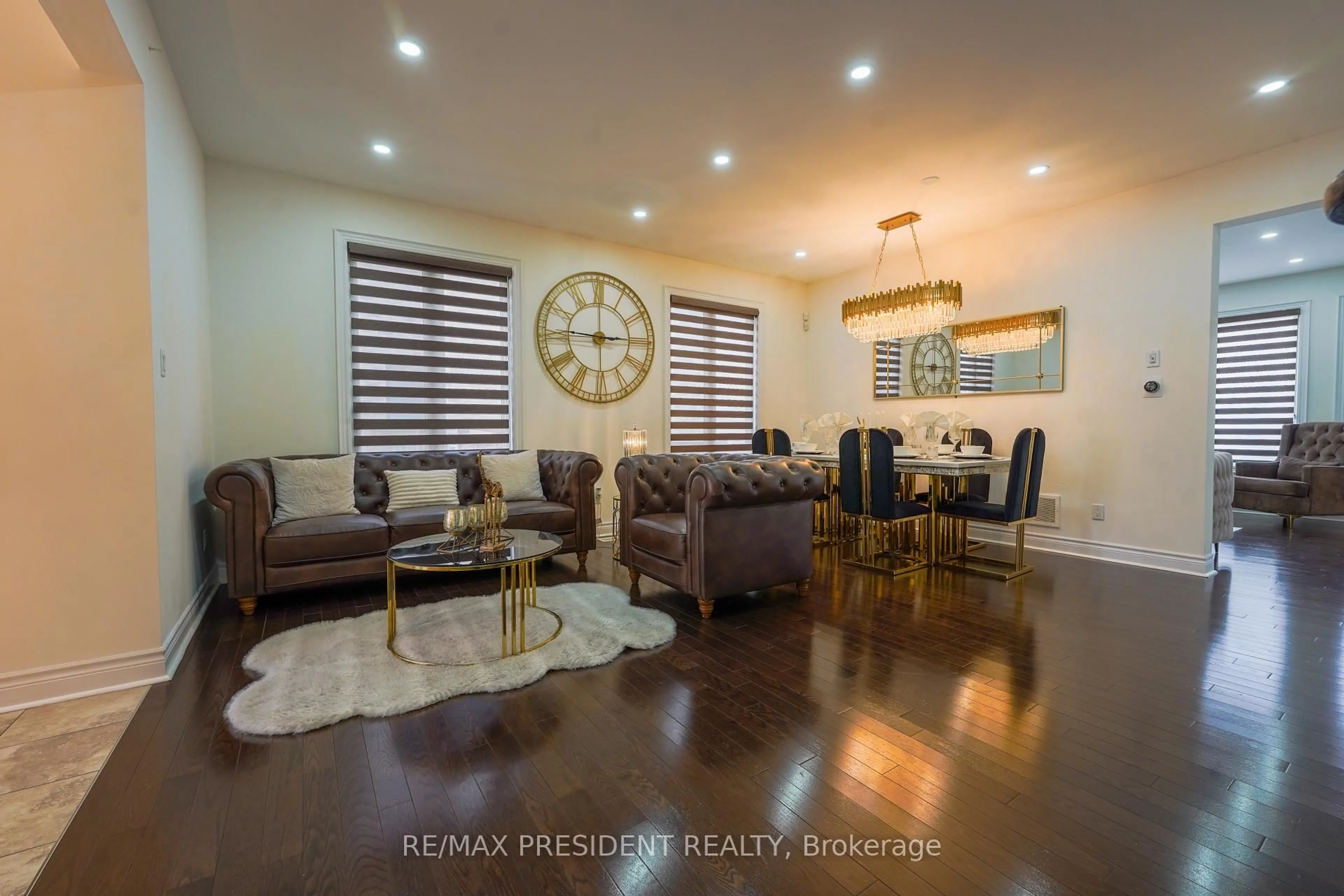 Living room with furniture, wood/laminate floor for 16 Bassett Cres, Brampton Ontario L6X 5G2