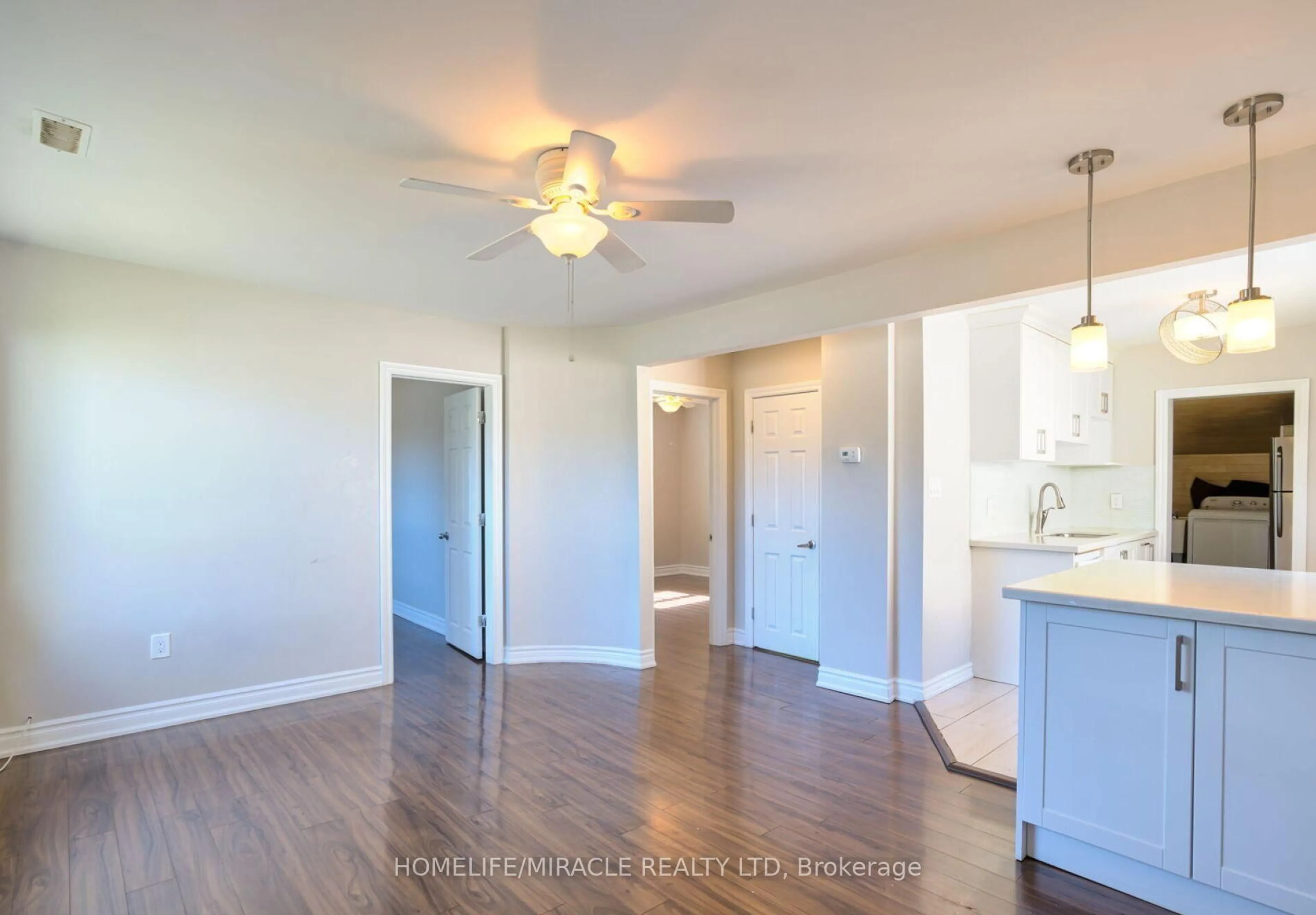 Open concept kitchen, wood/laminate floor for 72 Frederick St, Brampton Ontario L6Y 1G8