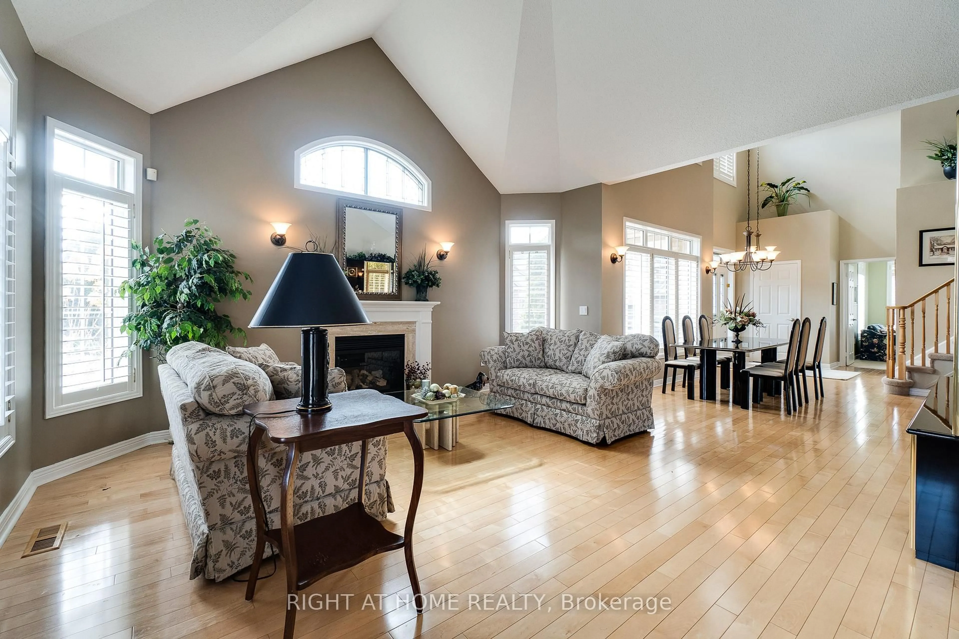 Living room with furniture, wood/laminate floor for 4280 Taywood Dr #15, Burlington Ontario L7M 4X8