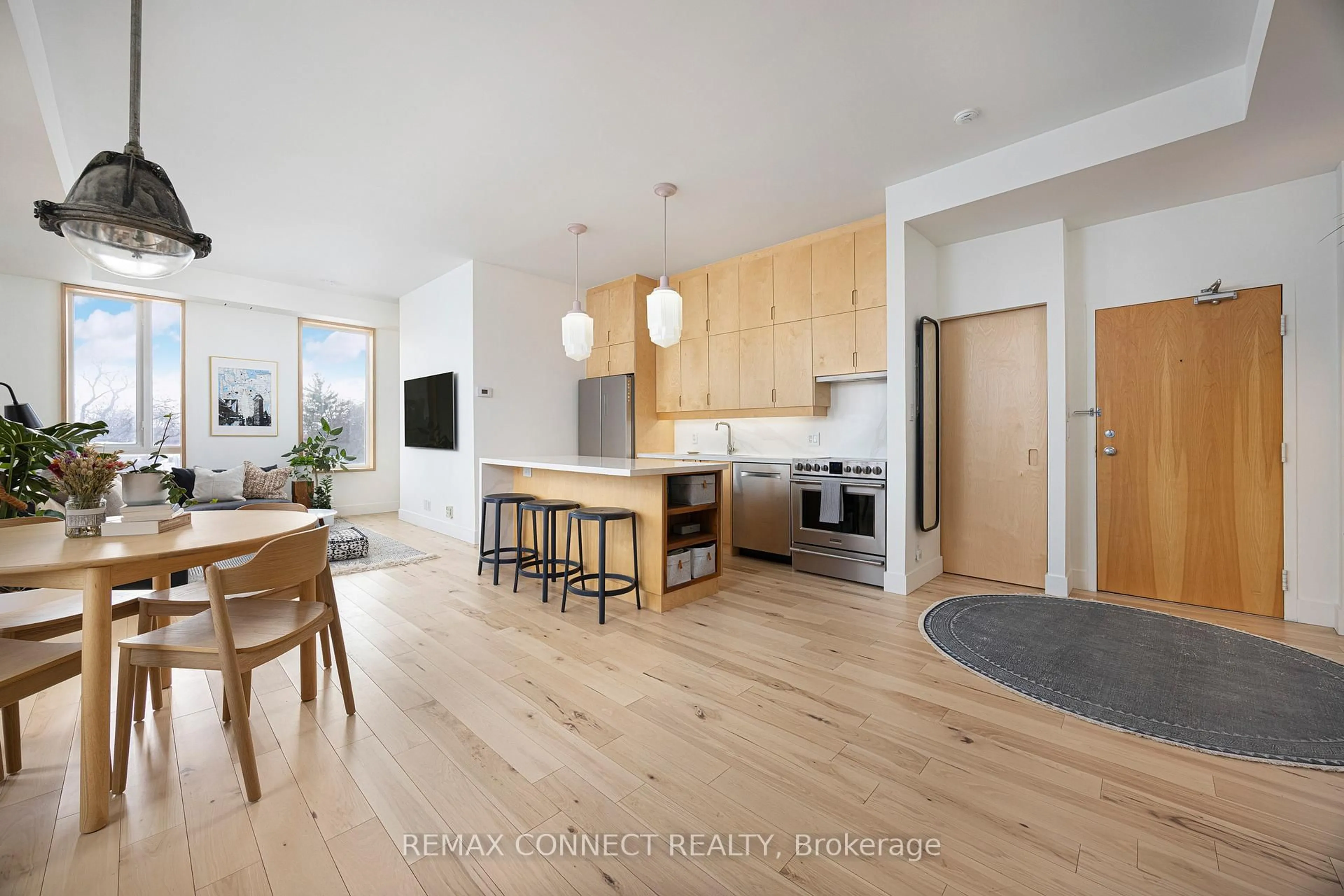 Open concept kitchen, wood/laminate floor for 1 St Johns Rd #402, Toronto Ontario M6P 1T7