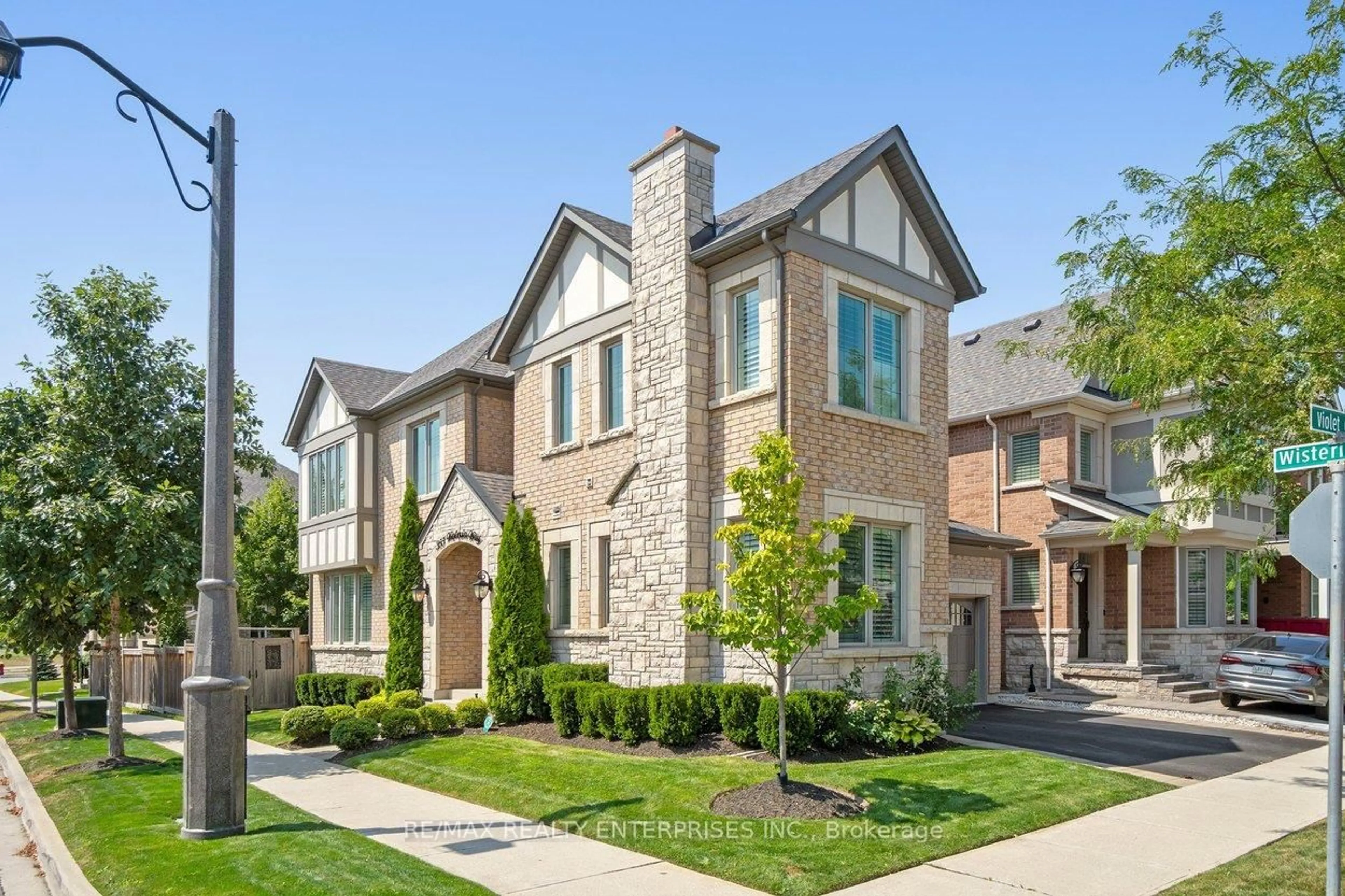 Home with brick exterior material, street for 355 Wisteria Way, Oakville Ontario L6M 1L6