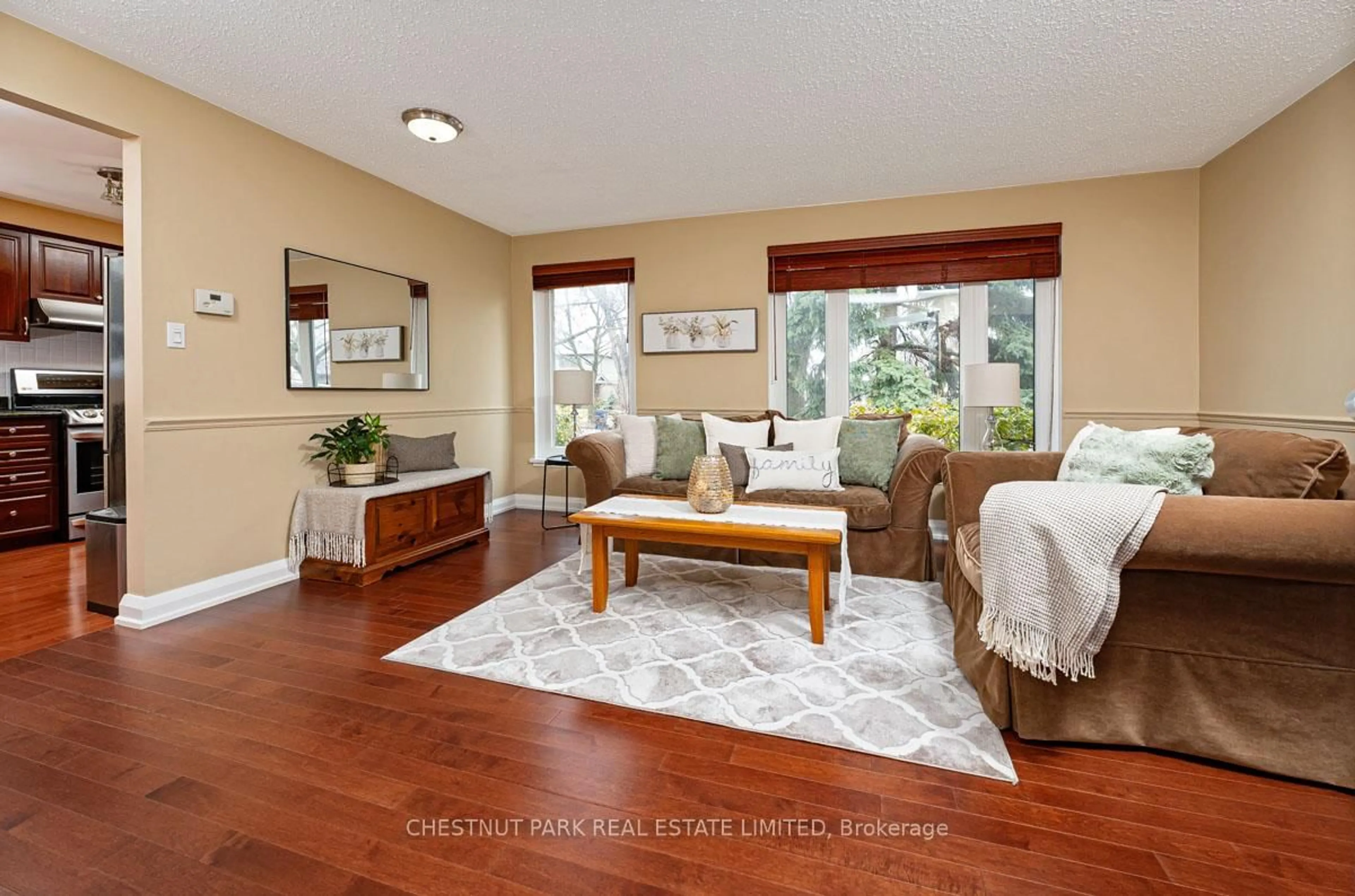 Living room with furniture, wood/laminate floor for 16 Vanderbrent Cres, Toronto Ontario M9R 3W8