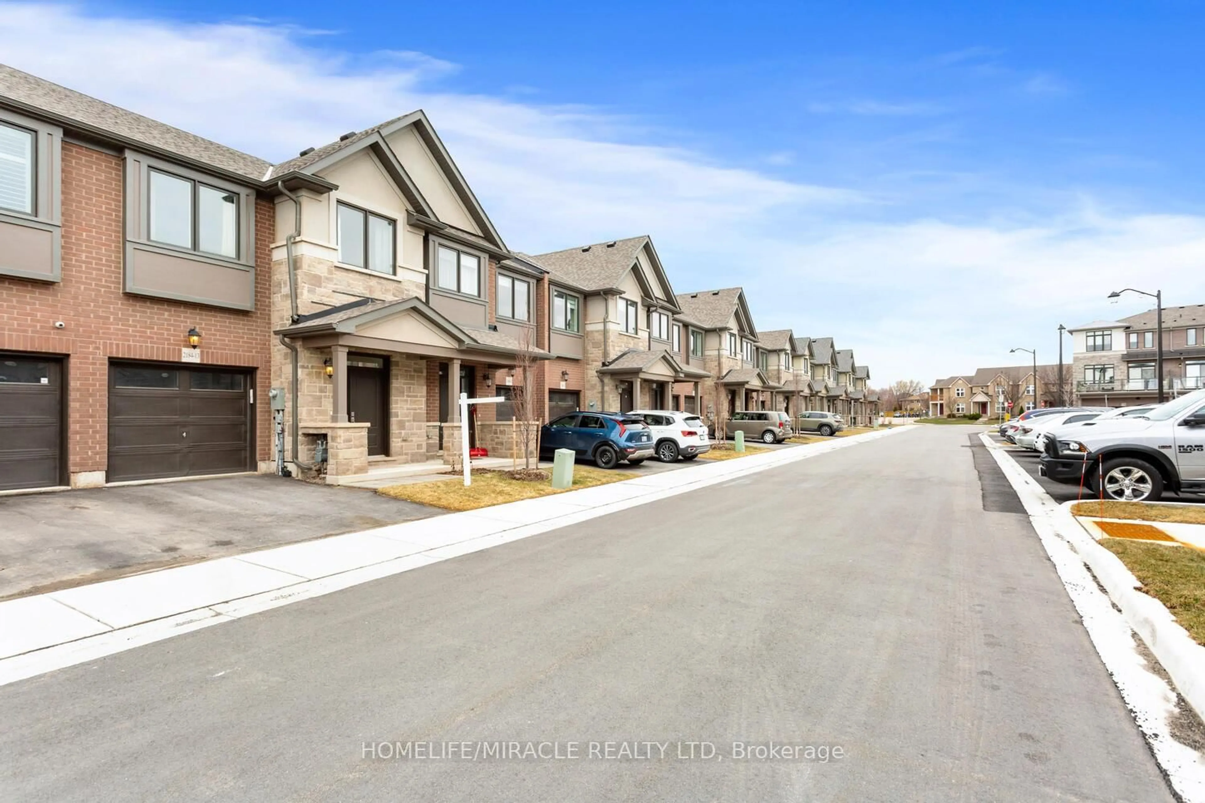 A pic from outside/outdoor area/front of a property/back of a property/a pic from drone, street for 2184 Postmaster Dr #13, Oakville Ontario L6M 3X1