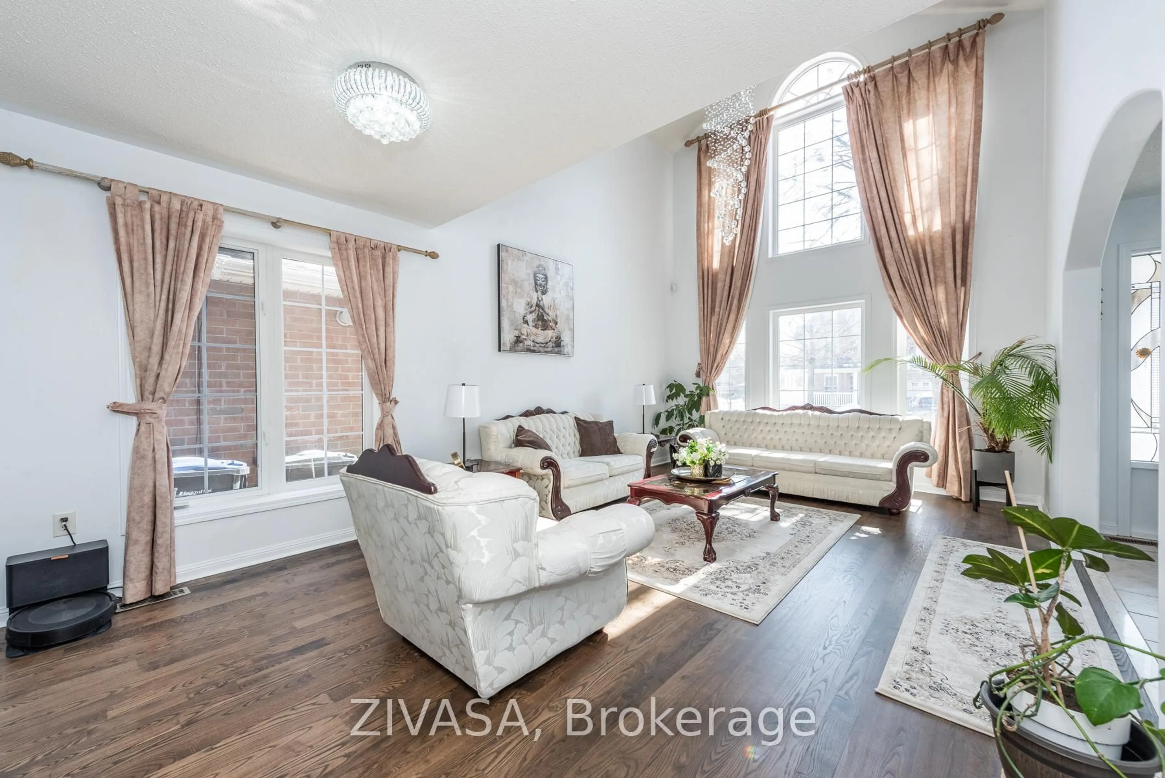 Living room with furniture, wood/laminate floor for 10 Upshall Dr, Brampton Ontario L6P 1E1