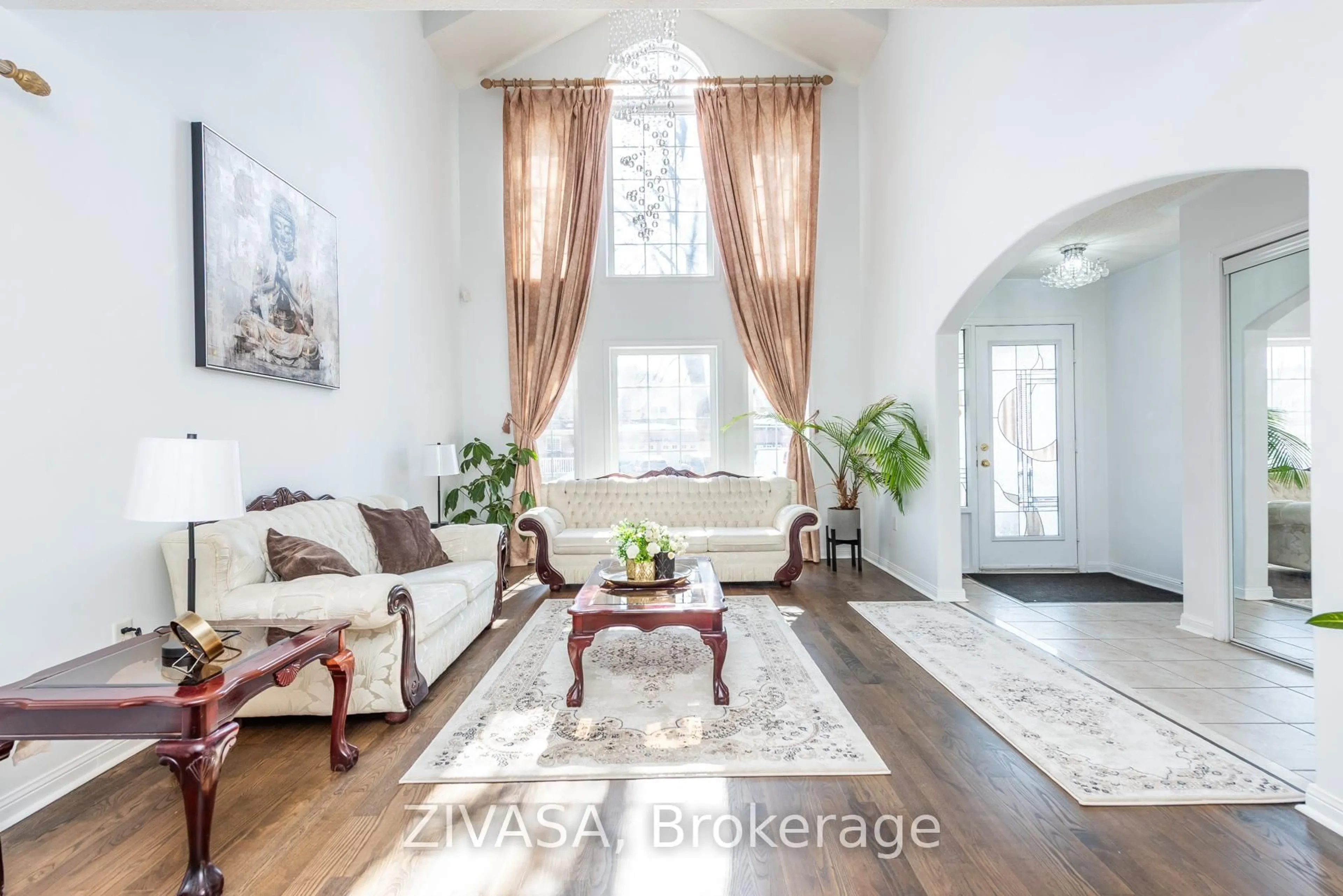 Living room with furniture, wood/laminate floor for 10 Upshall Dr, Brampton Ontario L6P 1E1