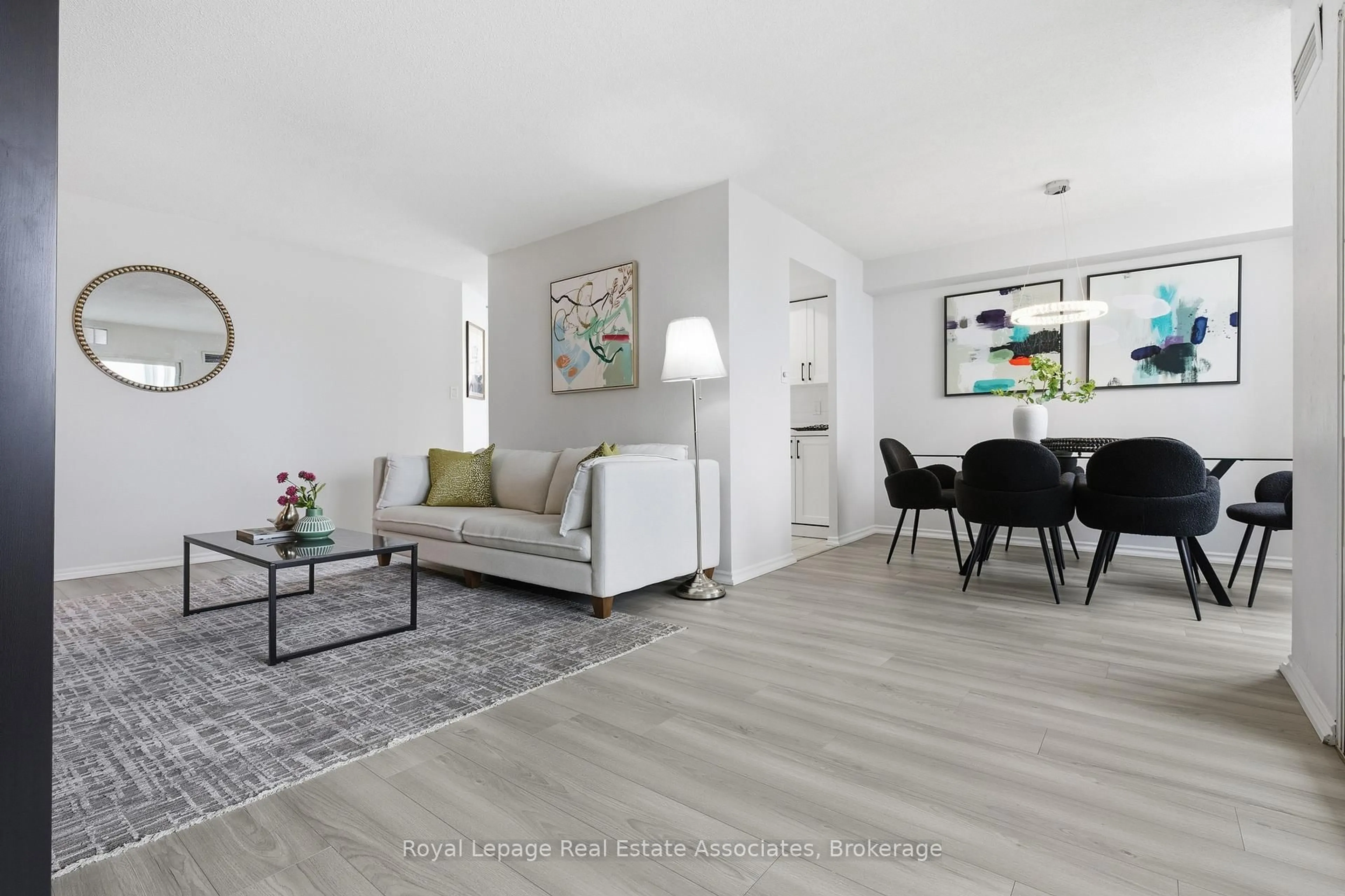 Living room with furniture, wood/laminate floor for 10 Malta Ave #1004, Brampton Ontario L6Y 4G6