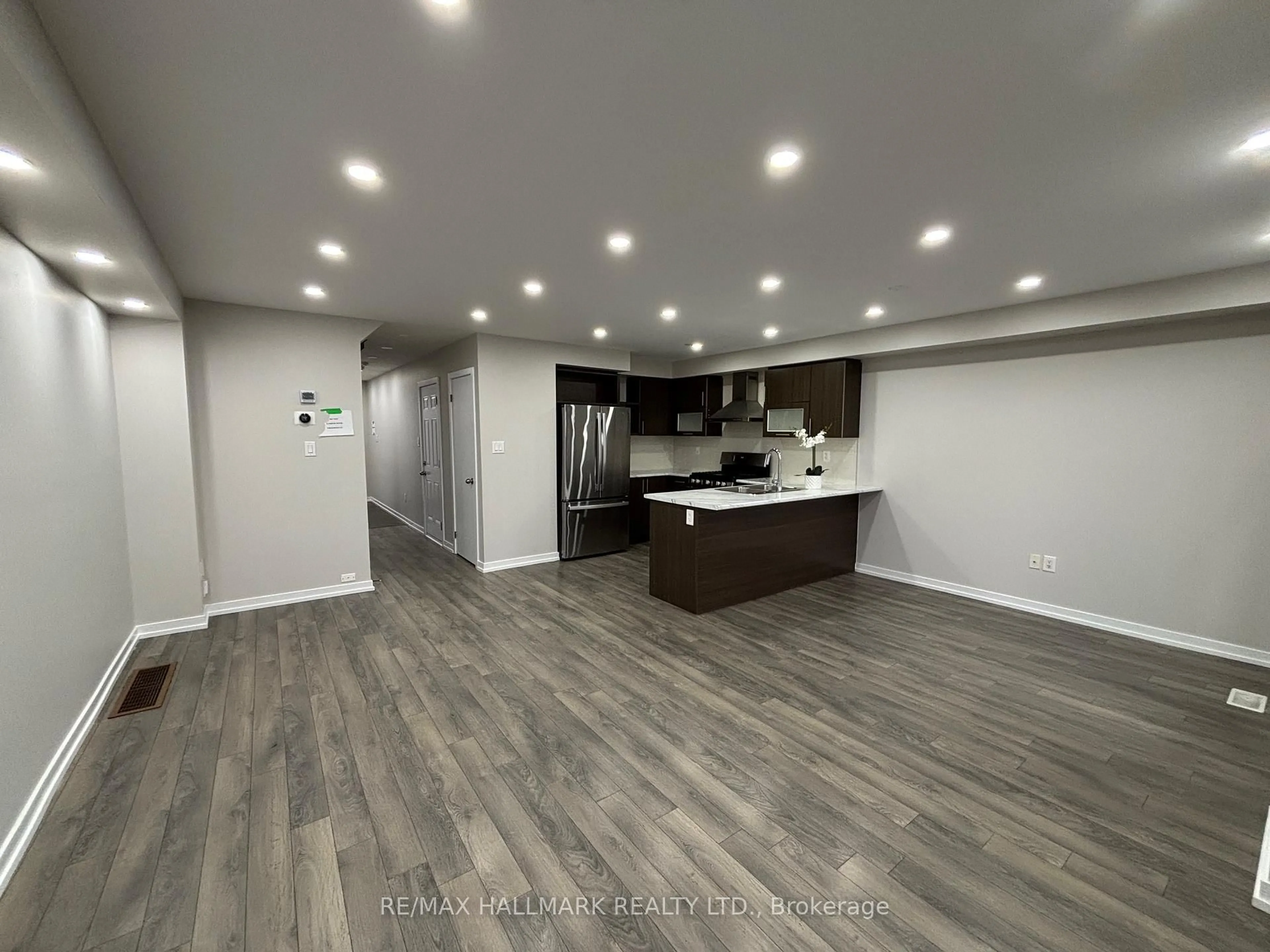 Open concept kitchen, wood/laminate floor for 94 Golden Springs Dr, Brampton Ontario L7A 0C7
