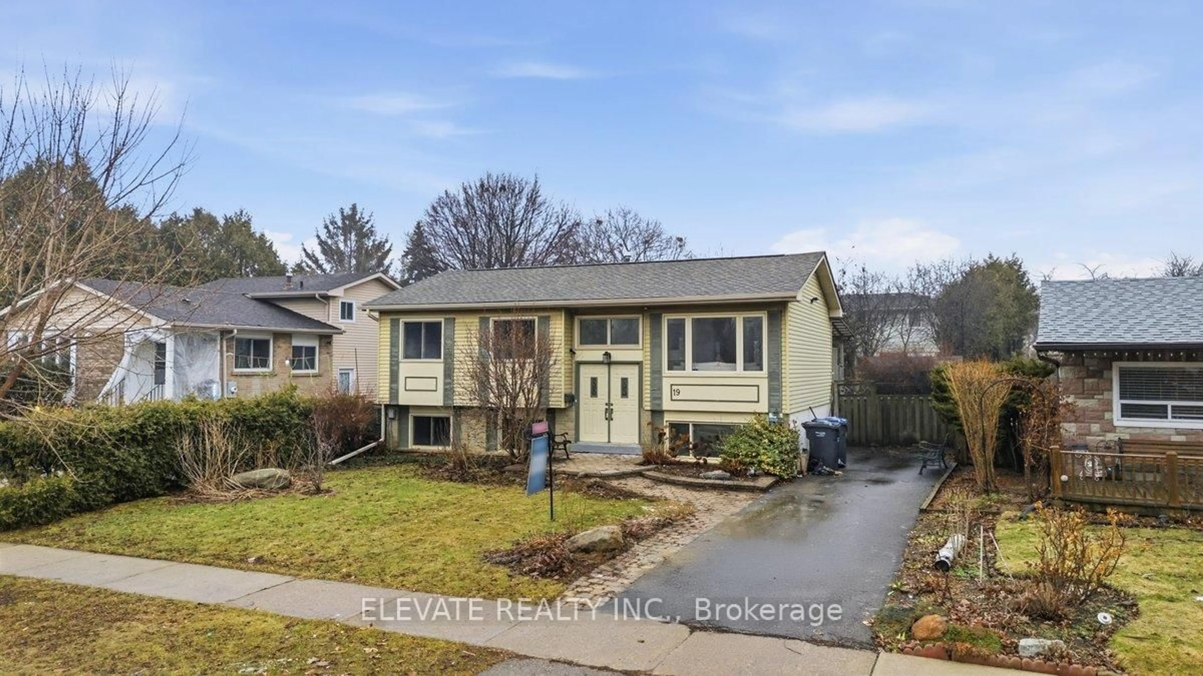 Home with vinyl exterior material, street for 19 Madoc Dr, Brampton Ontario L6V 1Z8