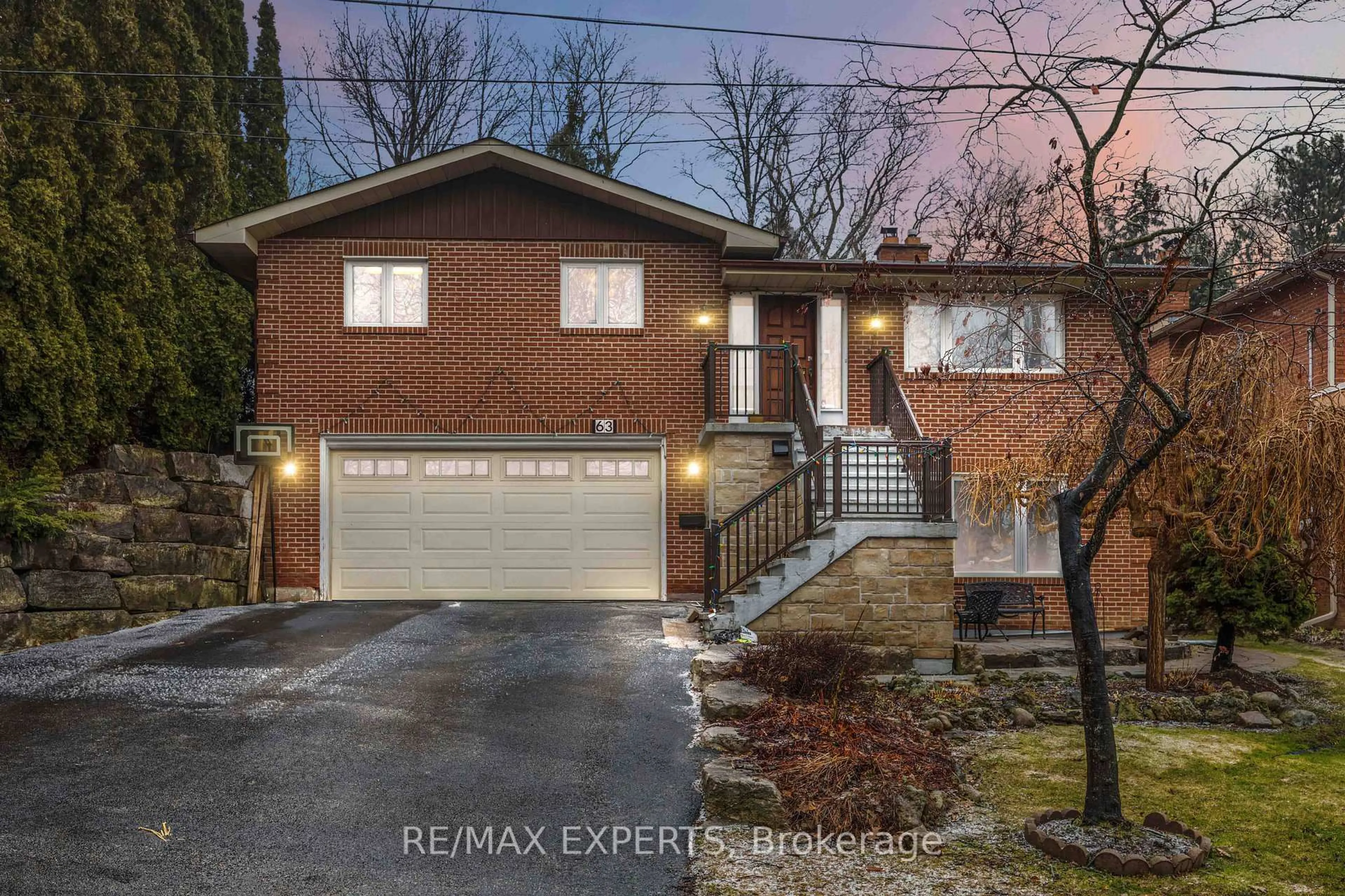 Home with brick exterior material, street for 63 Riverside Dr, Toronto Ontario M9L 1J2